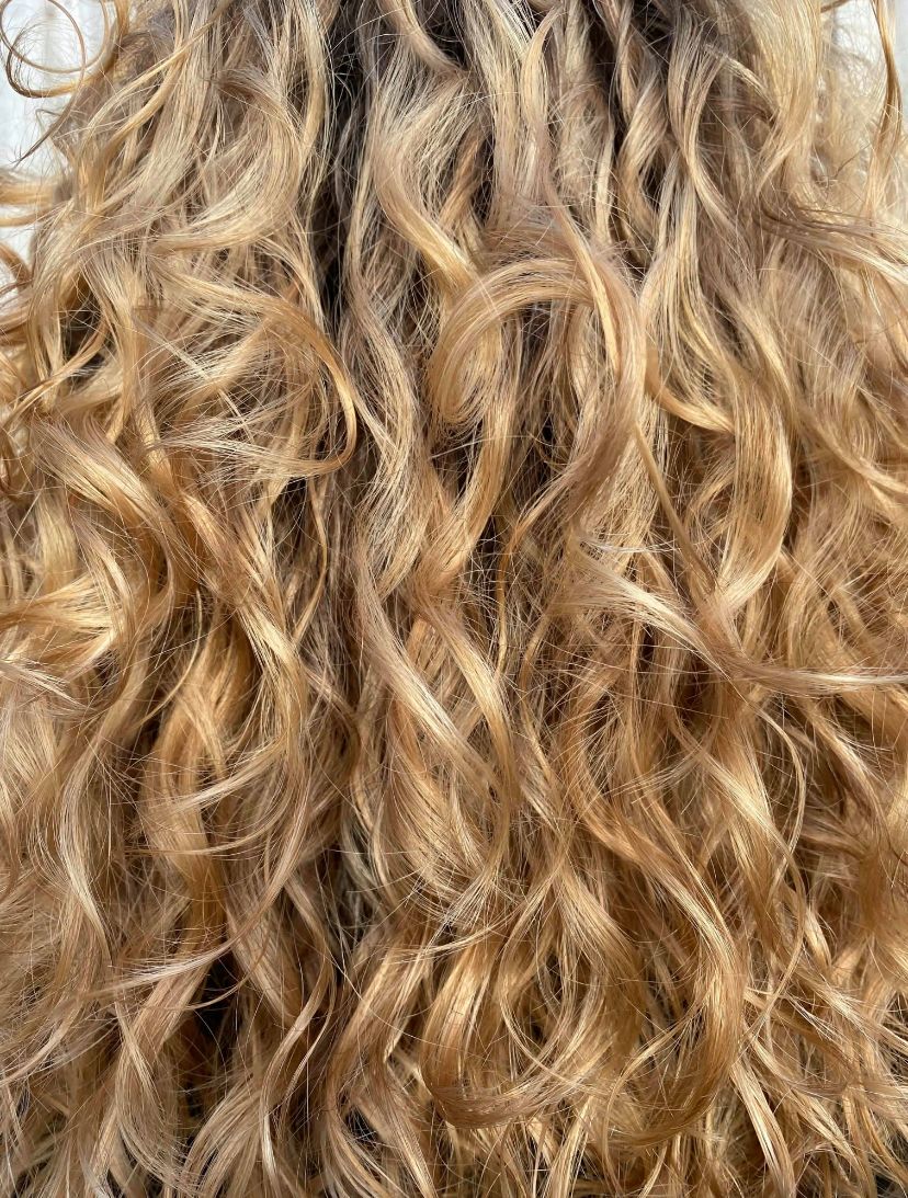 Using sandy and blonde tones to create this masterpiece styled with clients natural curls