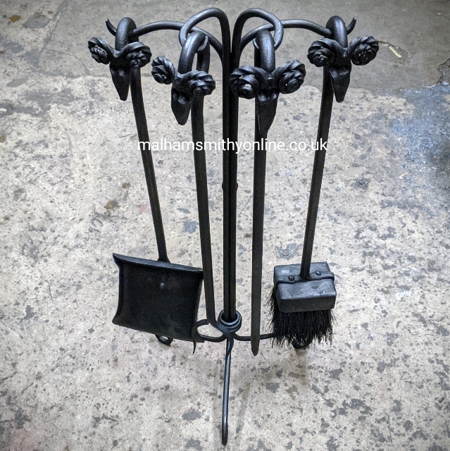Ram's head poker, shovel, brush and toasting fork on a simple stand with wrap detail