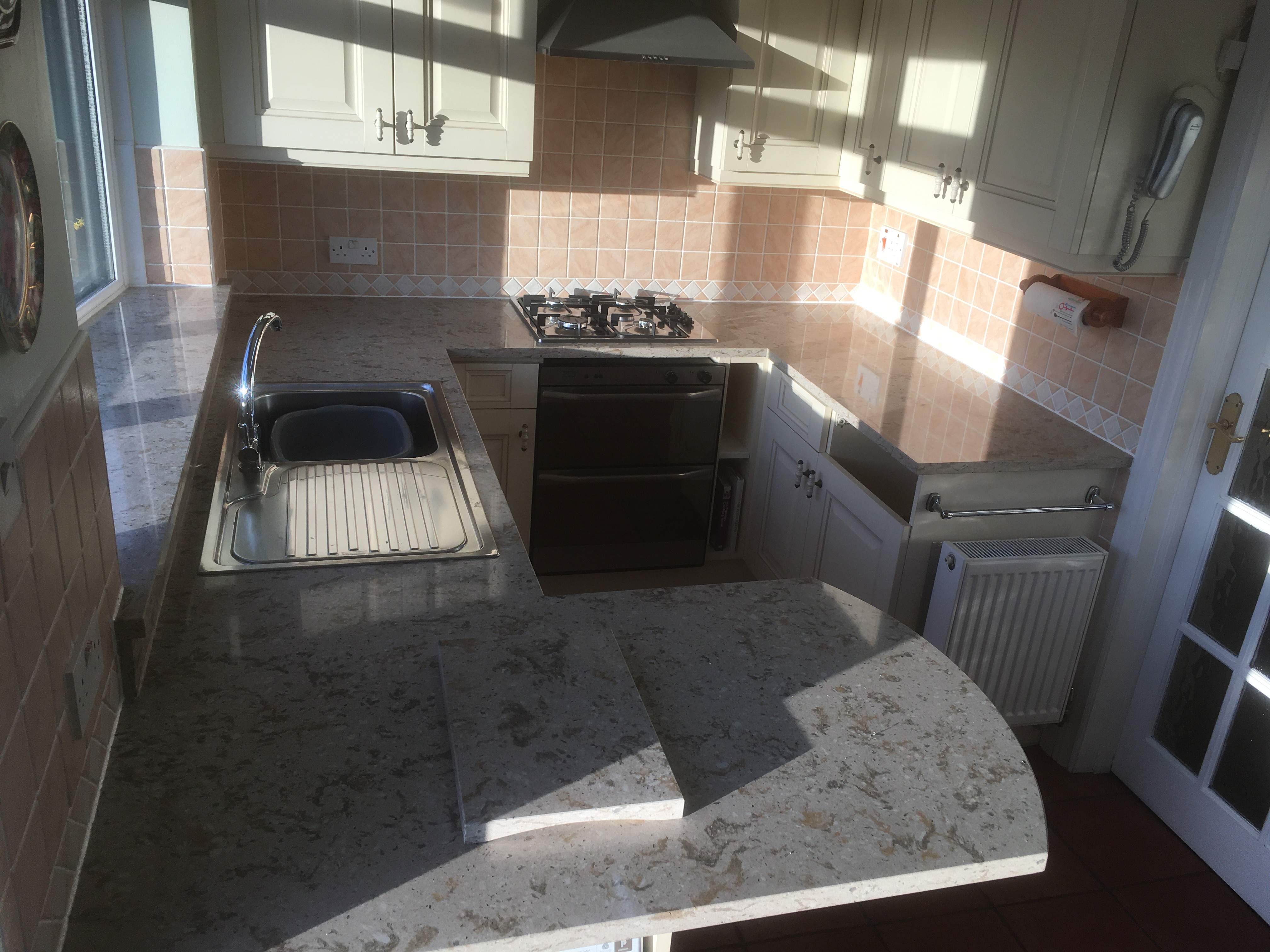 this is part of a kitchen makeover with new worktops in composite quartz