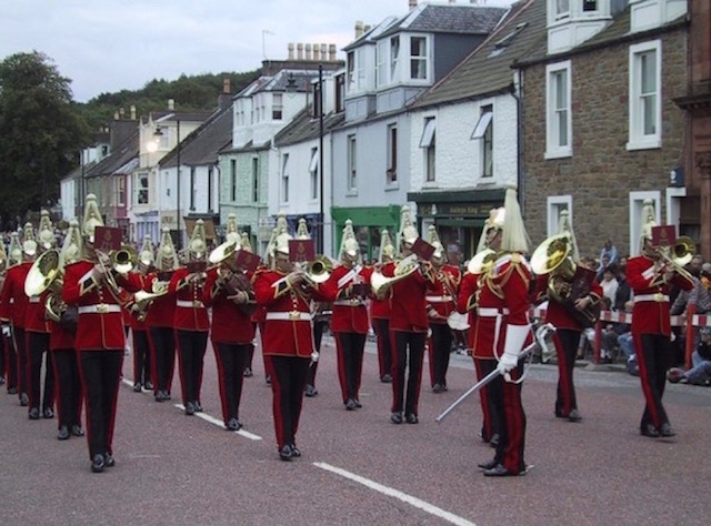 A brass band in splendid regalia performing at one of the Summer Festivities events in Kirkcudbright