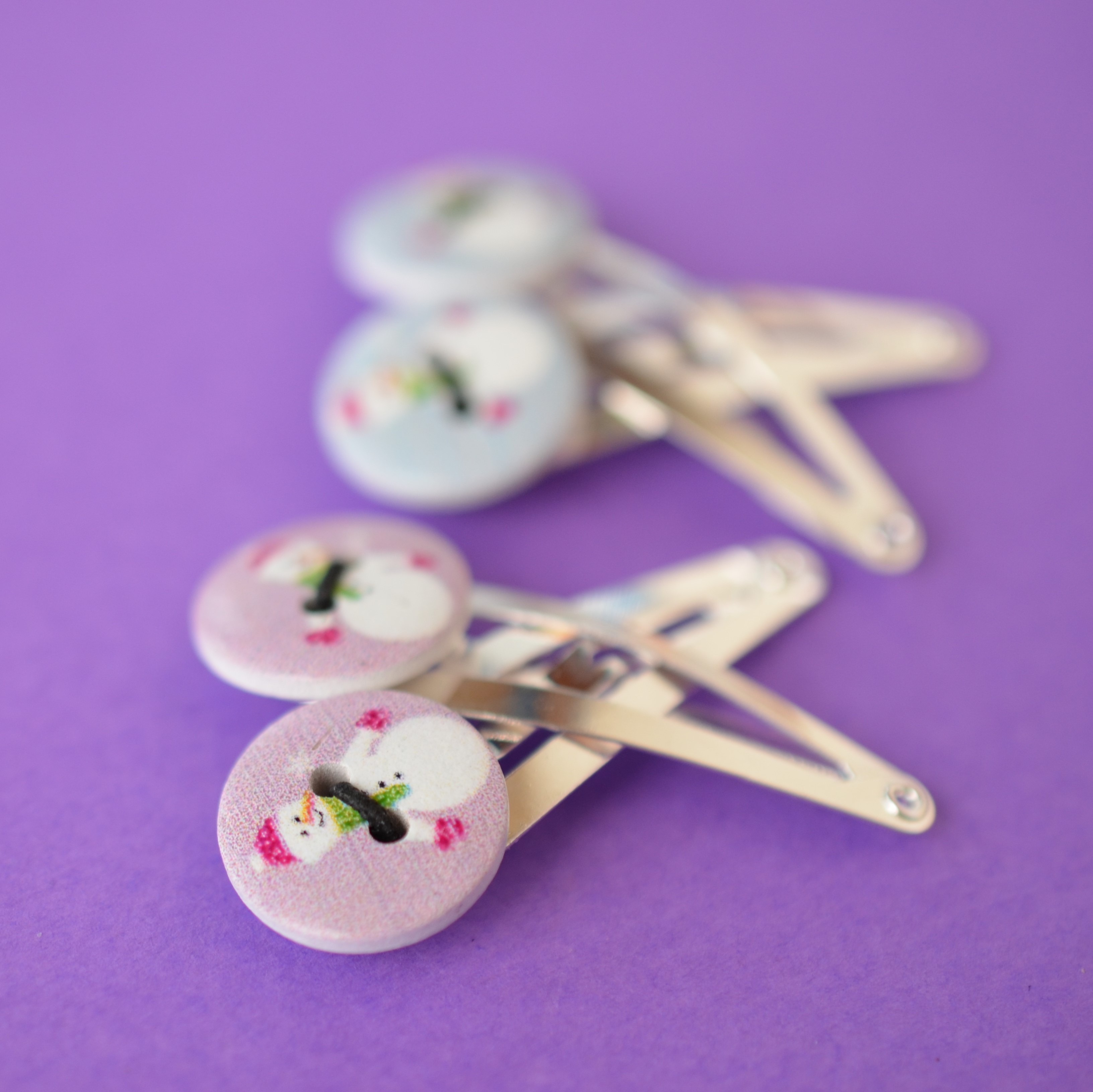 Two Pairs of Christmas Button Hair Clips with Cute Snowman Pale Blue & Pink Lavender Colours