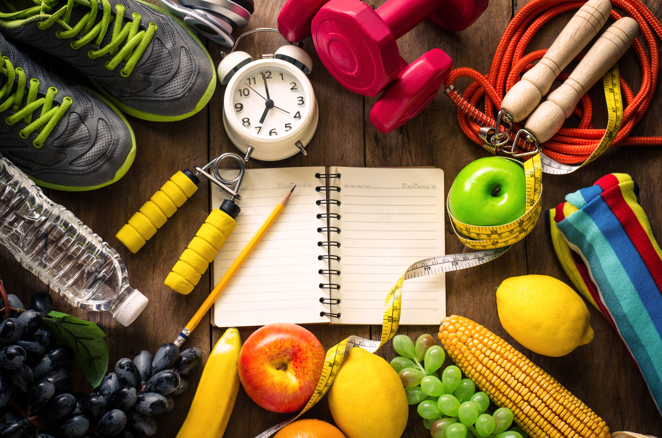high-angle-view-of-various-fruits-with-exercise-equipment-on-tablejpg