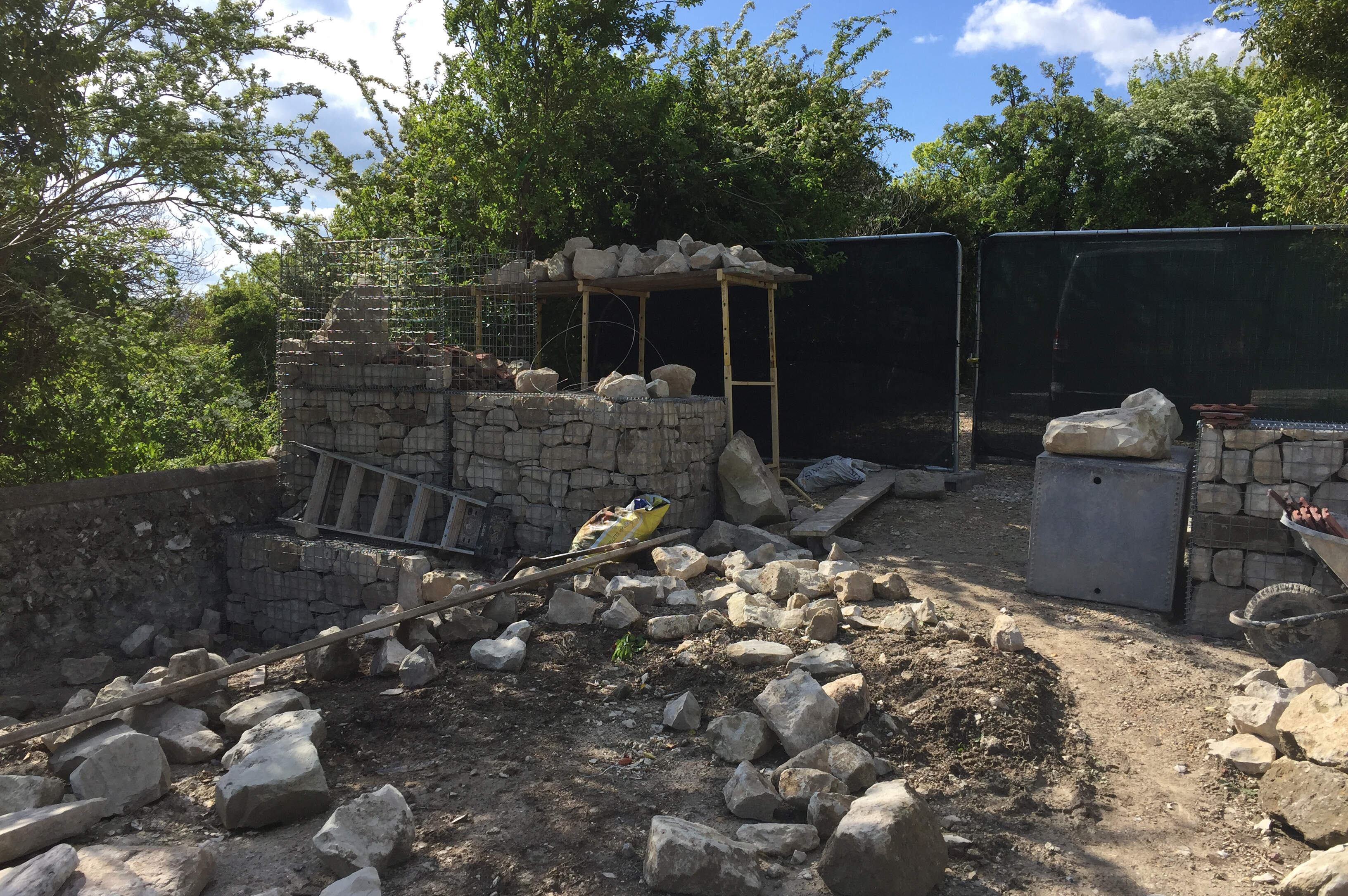 Reclained stone from the old barn was used in the construction of the gabions.
