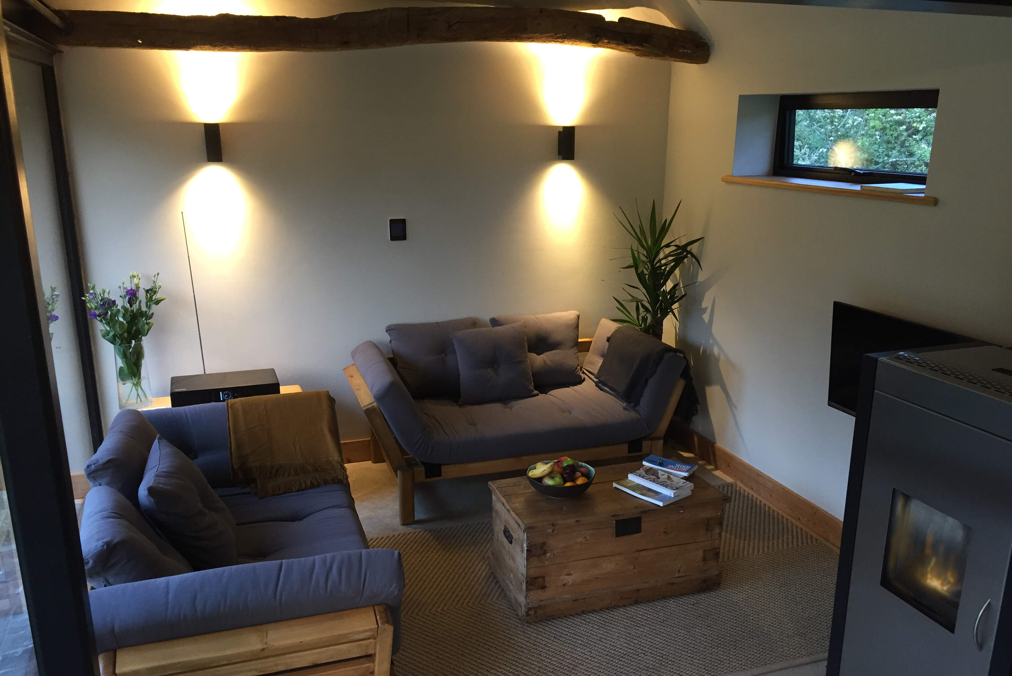 The cosy living area with two sofas that fold out to provide two comfortable single beds.