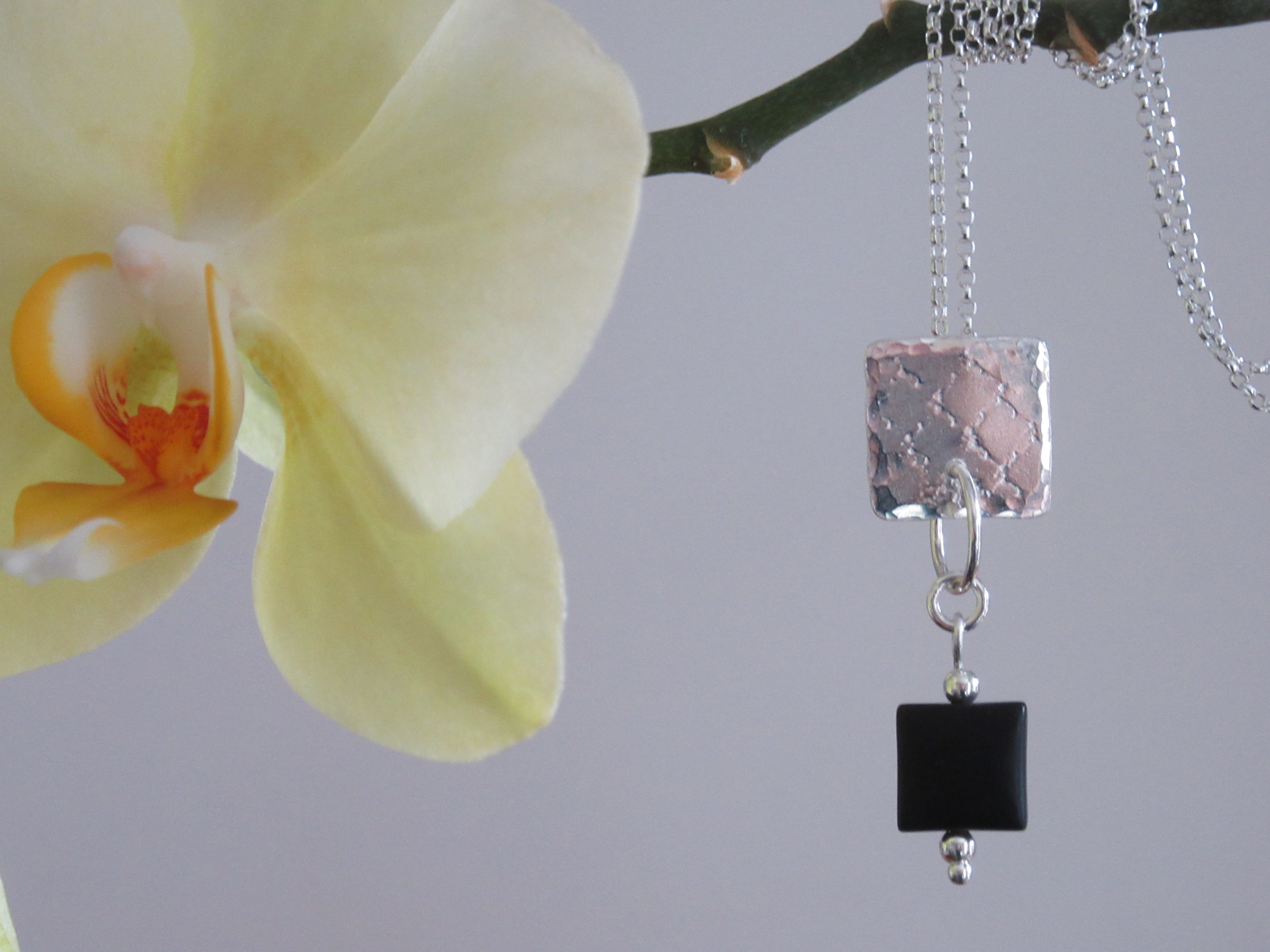 Textured silver pendant with black matt agate drop