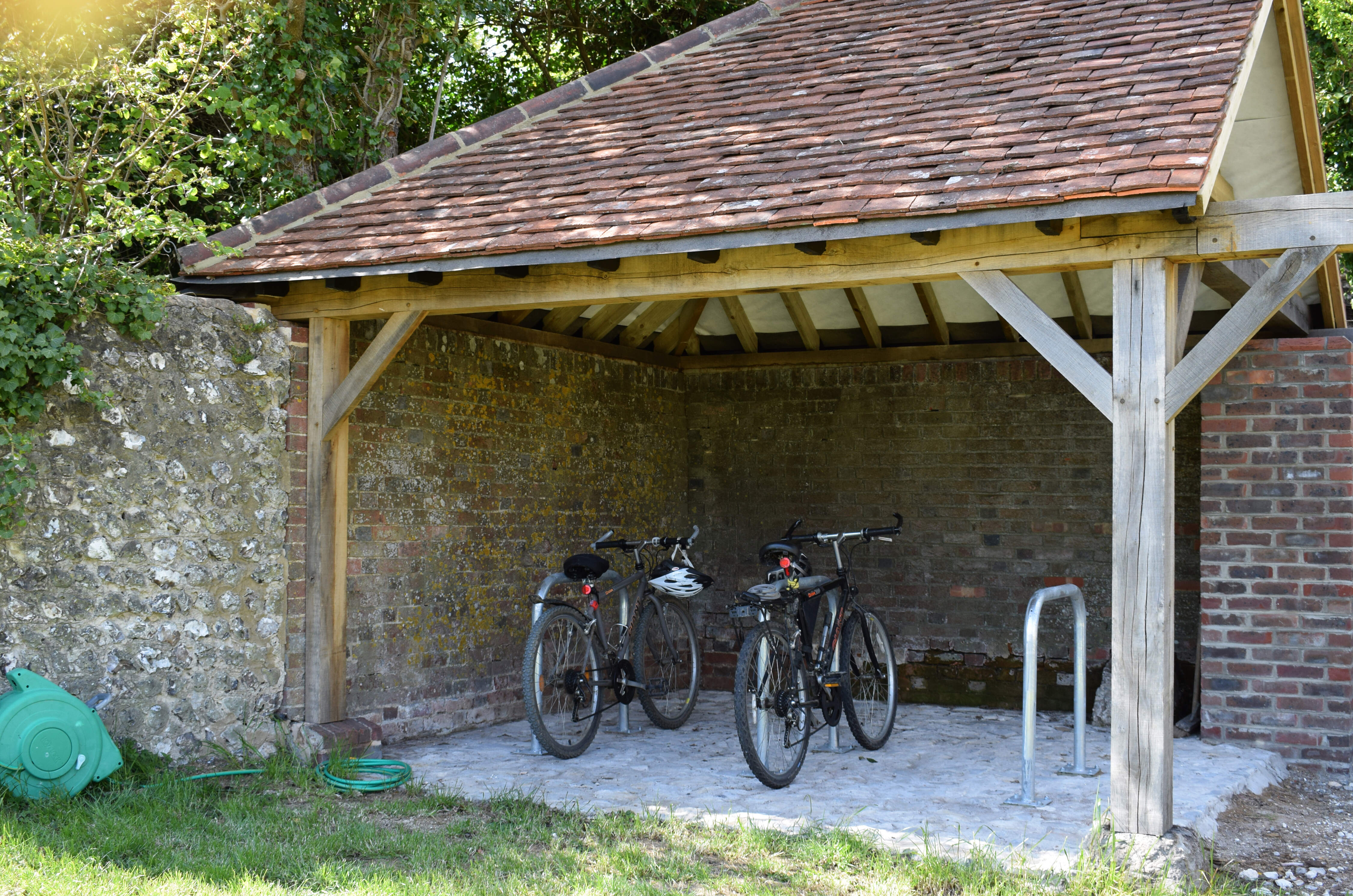 The cycle store provides secure, dry storage for cycles and equipment, and a hose for cycle cleaning