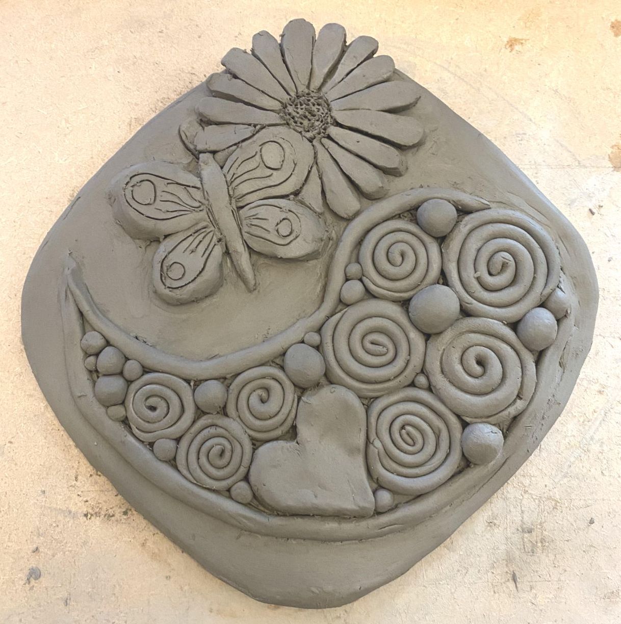 Clay wall hanging created by Rachel Akers