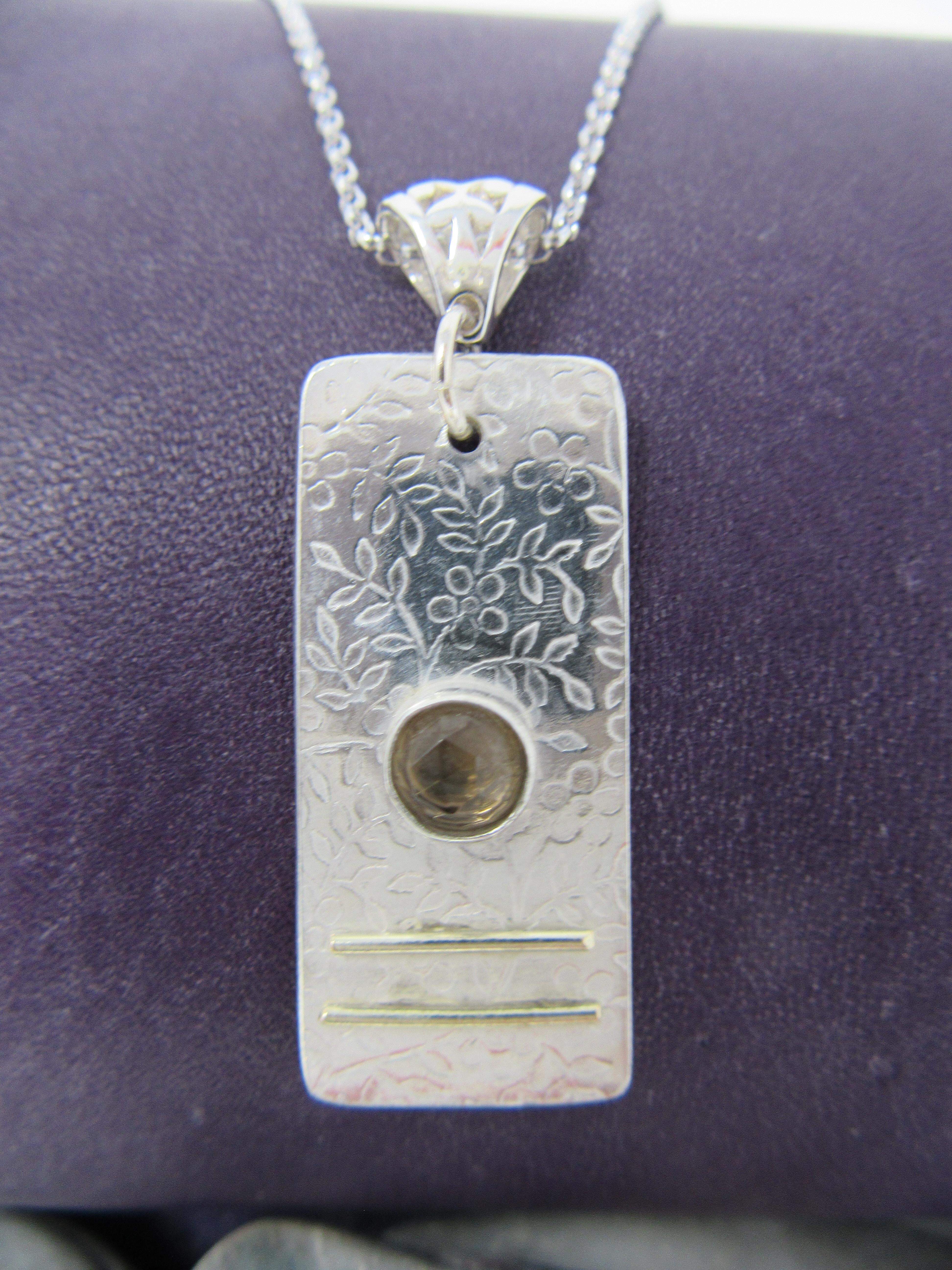 Smoky quartz silver pendant with filigree bezel