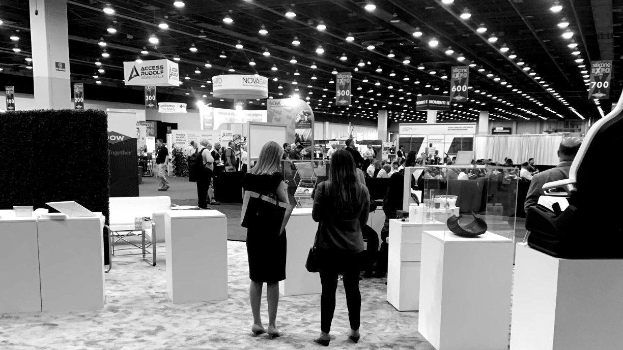 Black and white photo of attendees at the Expo