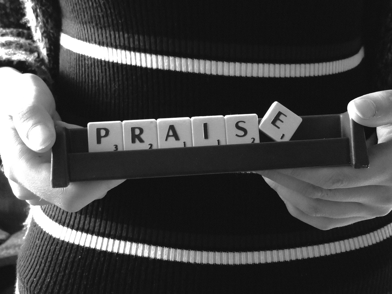 Praise, written in scrabble tiles