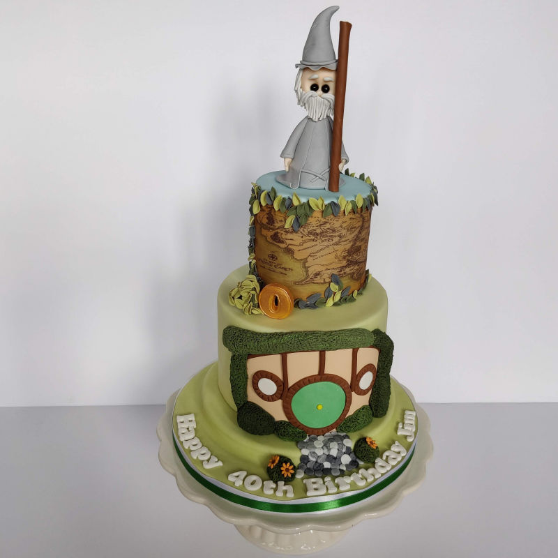 Lord of the Rings themed cake with Gandalf, Hobbit Hole and Middle Earth map.