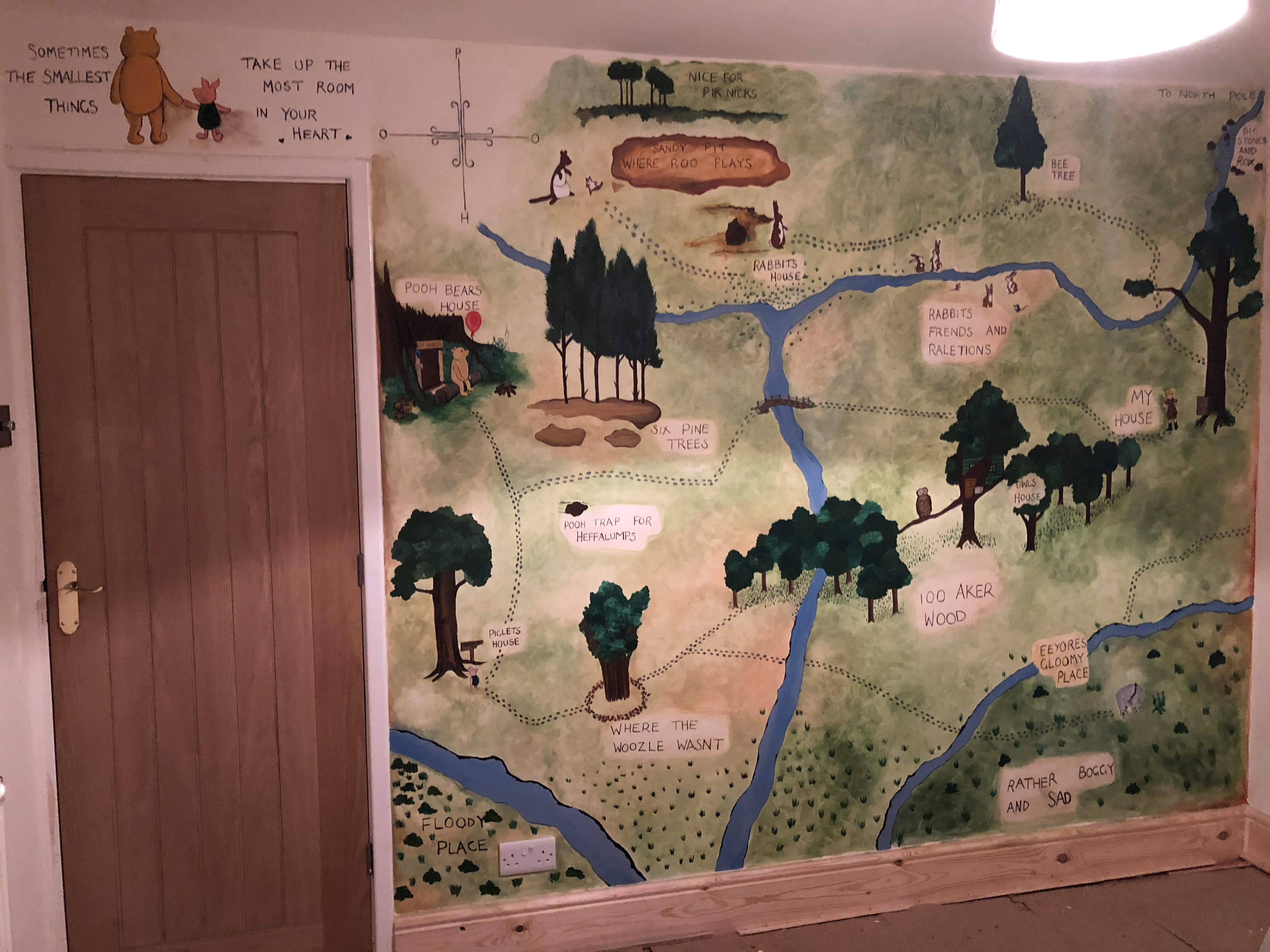 Hand painted mural of the map from Winnie the Pooh for a child nursery