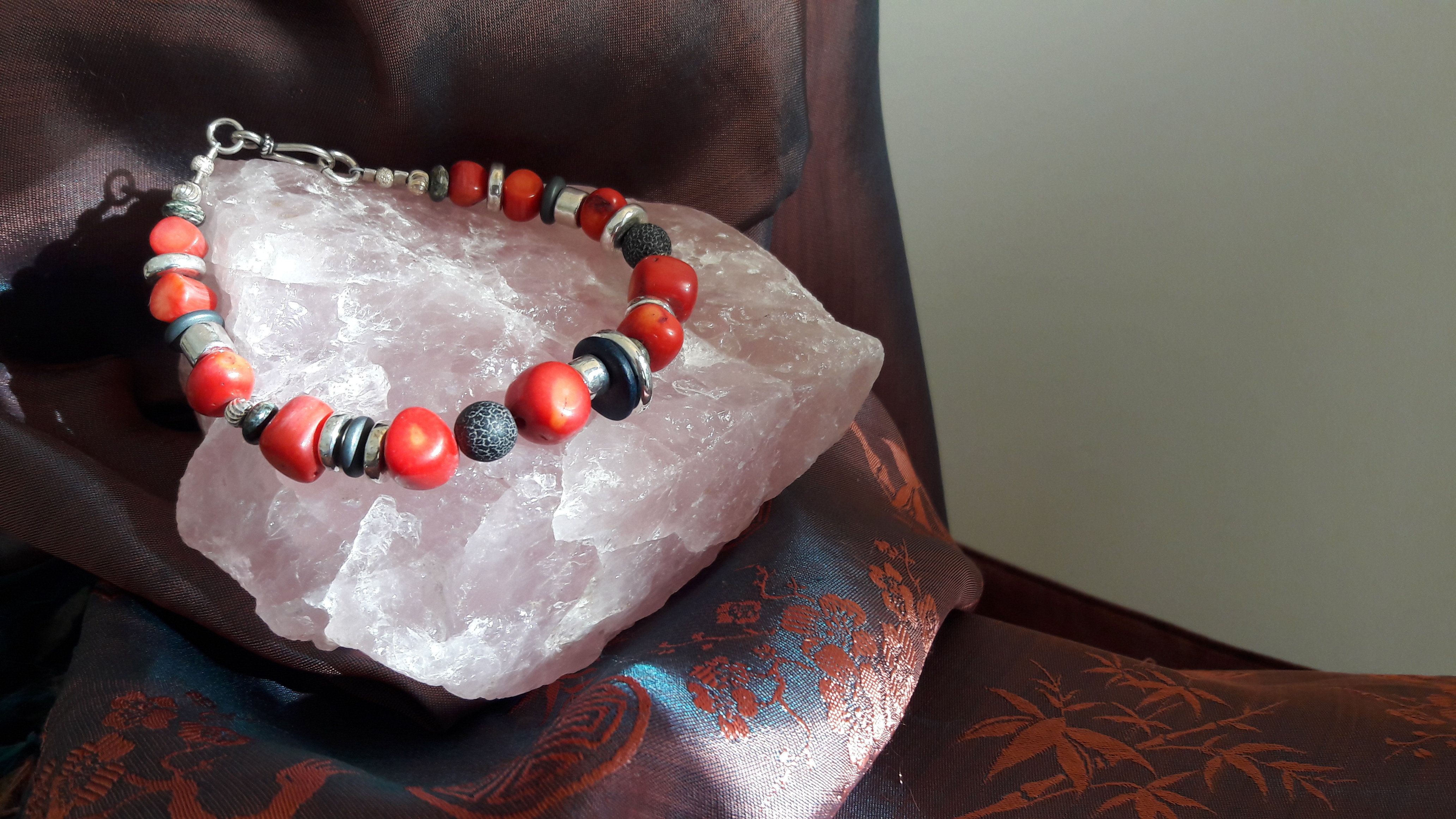 Coral and black lava bracelet