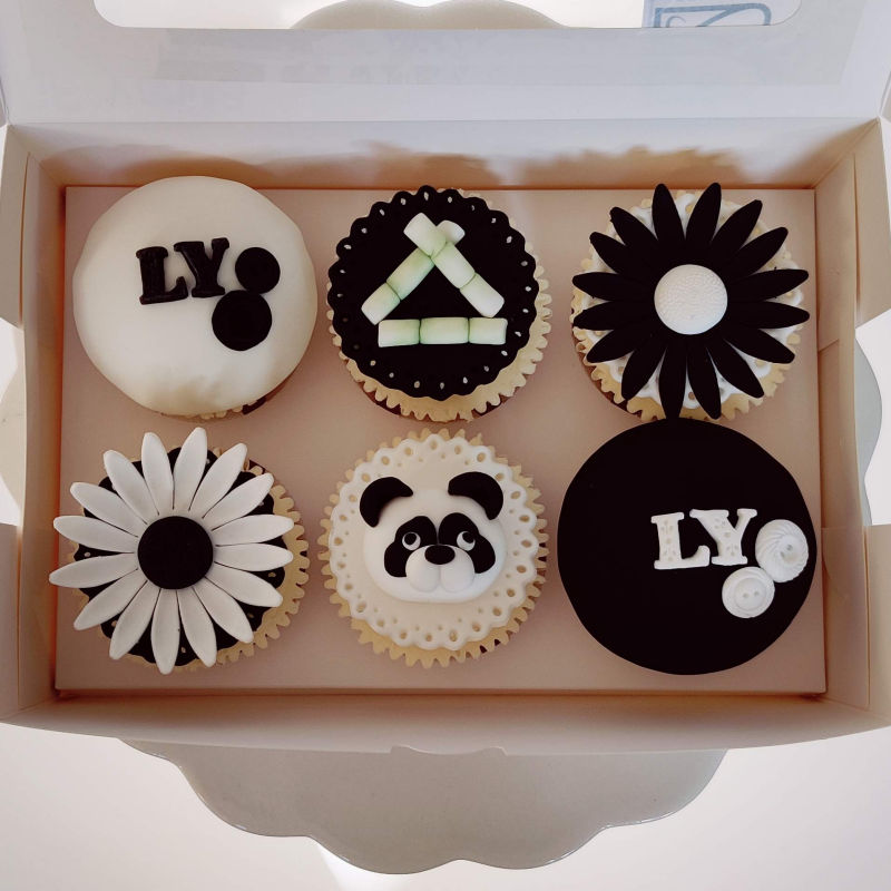 Panda themed cupcake selection in monochrome.