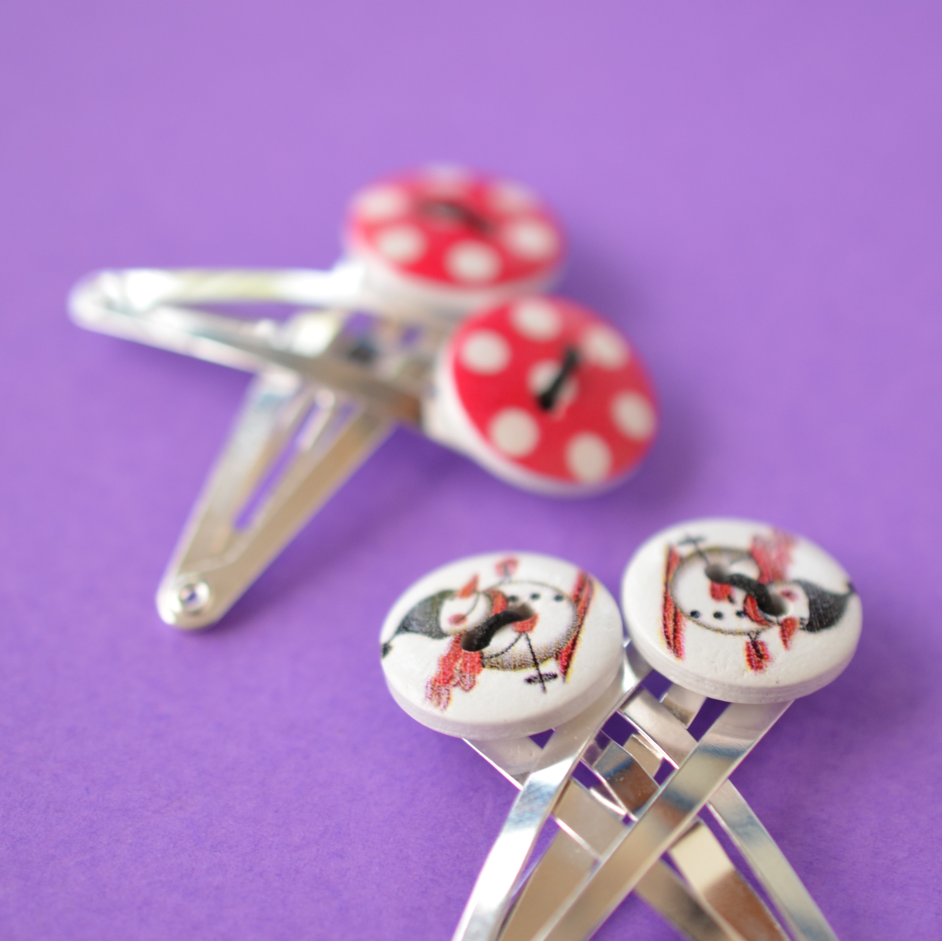 Two Pairs of Christmas Button Hair Clips with Skiing Snowman and Red and White Dot design