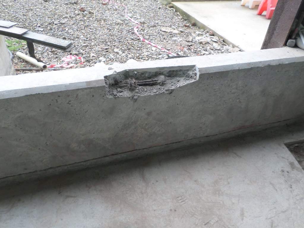 Deteriorated concrete removed using power tools
