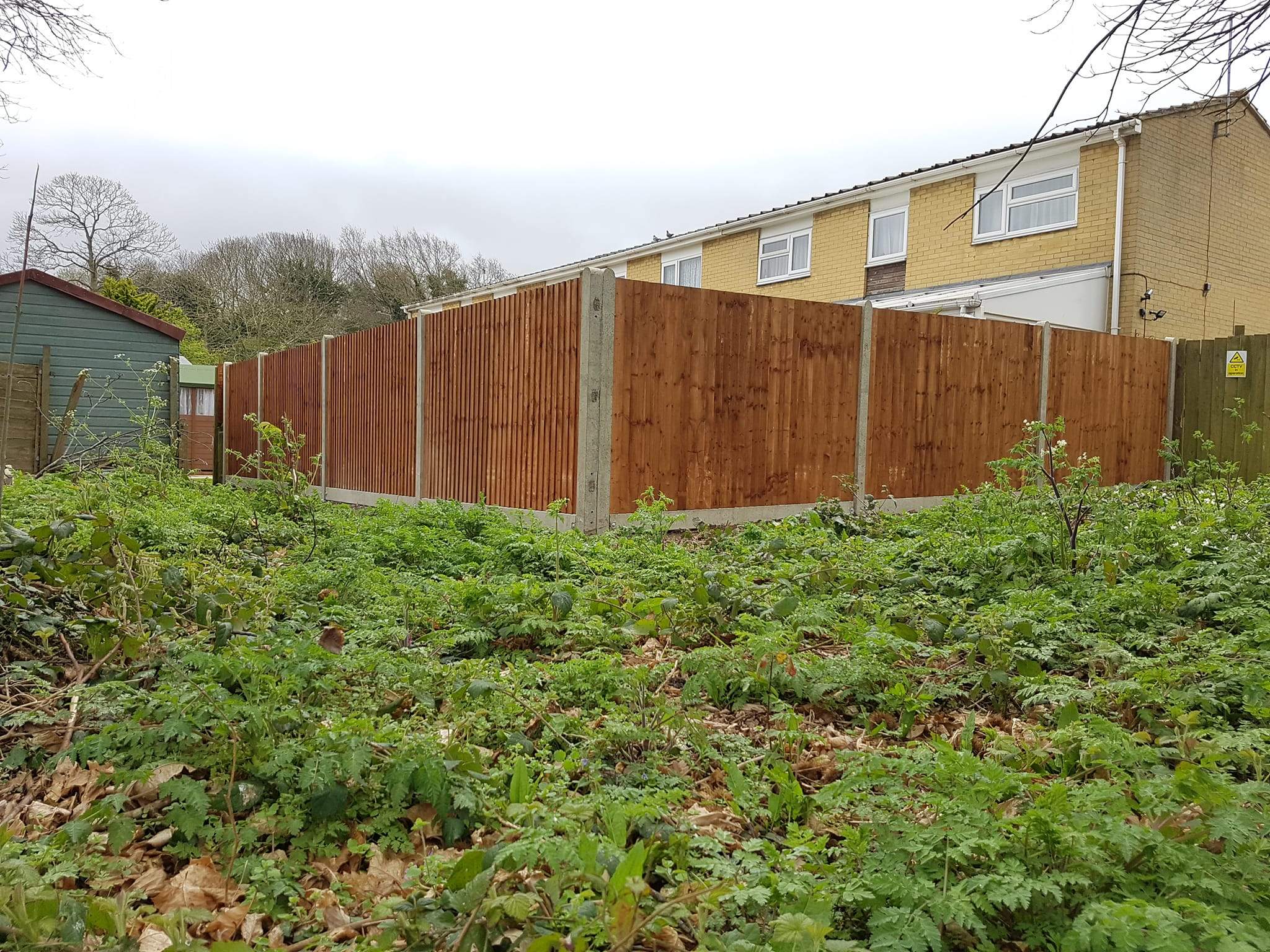 With concrete posts and concrete gravel-boards,fencing installed in Rochester