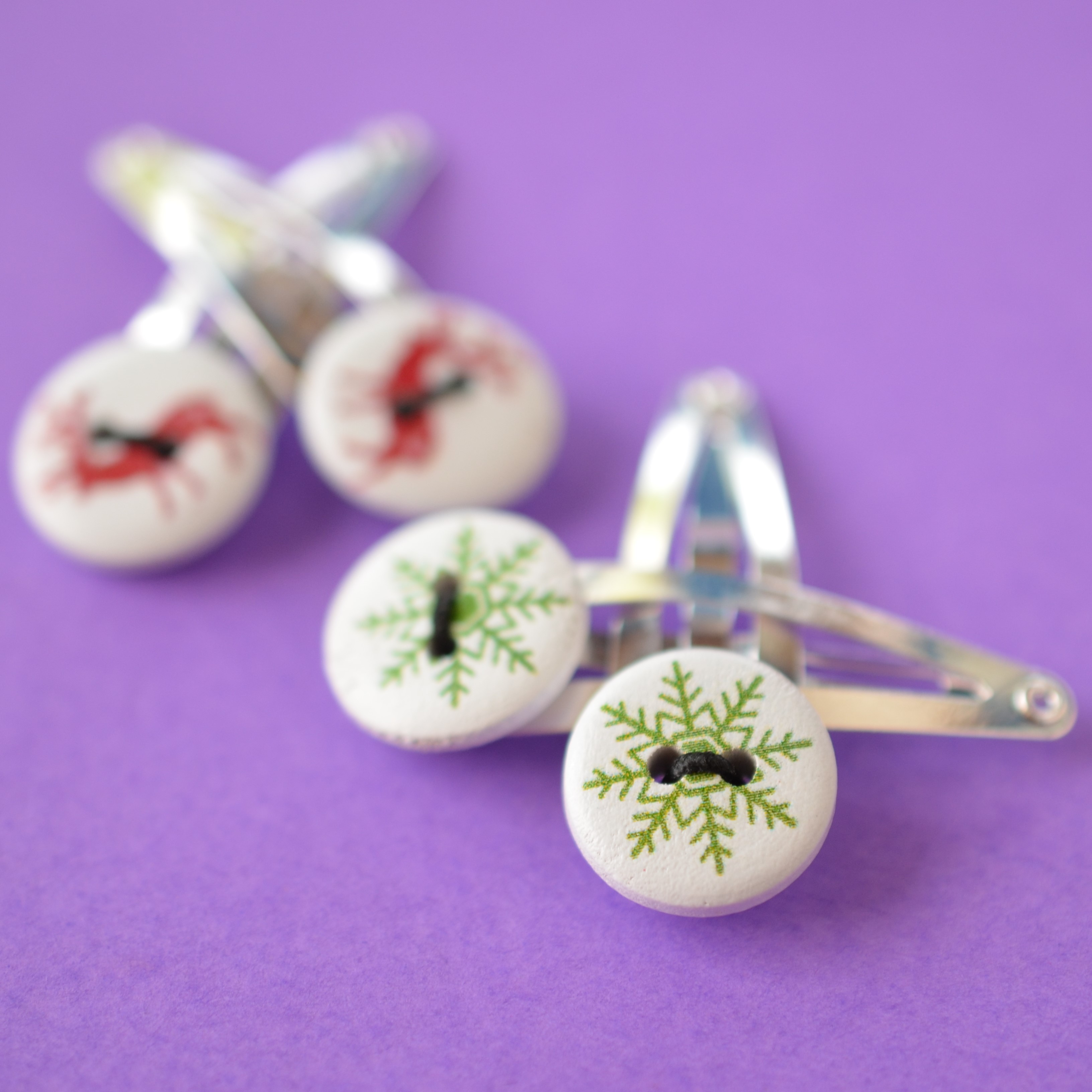 Two Pairs of Christmas Button Hair Clips with Reindeer and Green Snowflake design