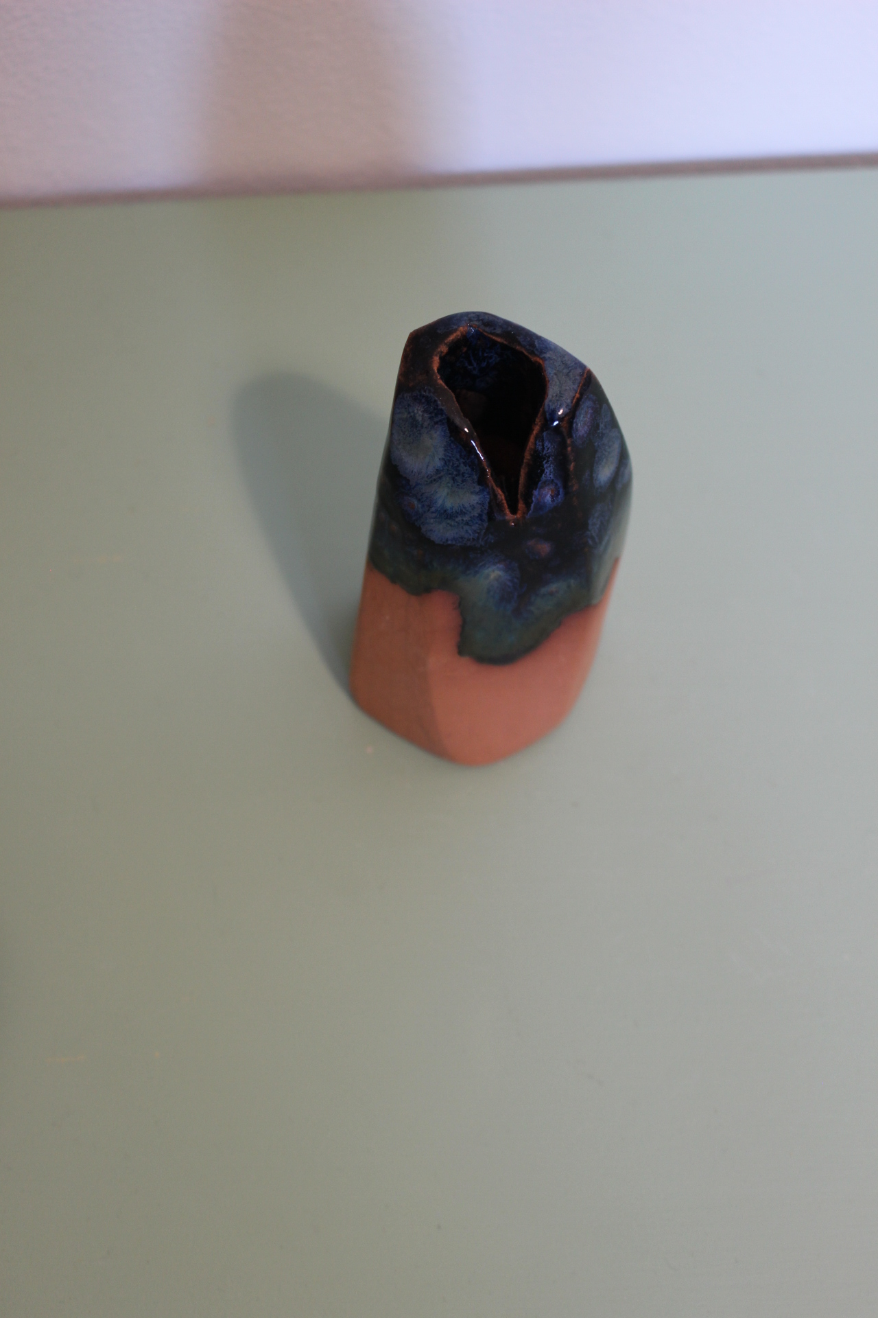 Small terracotta vase with blue crystal glaze