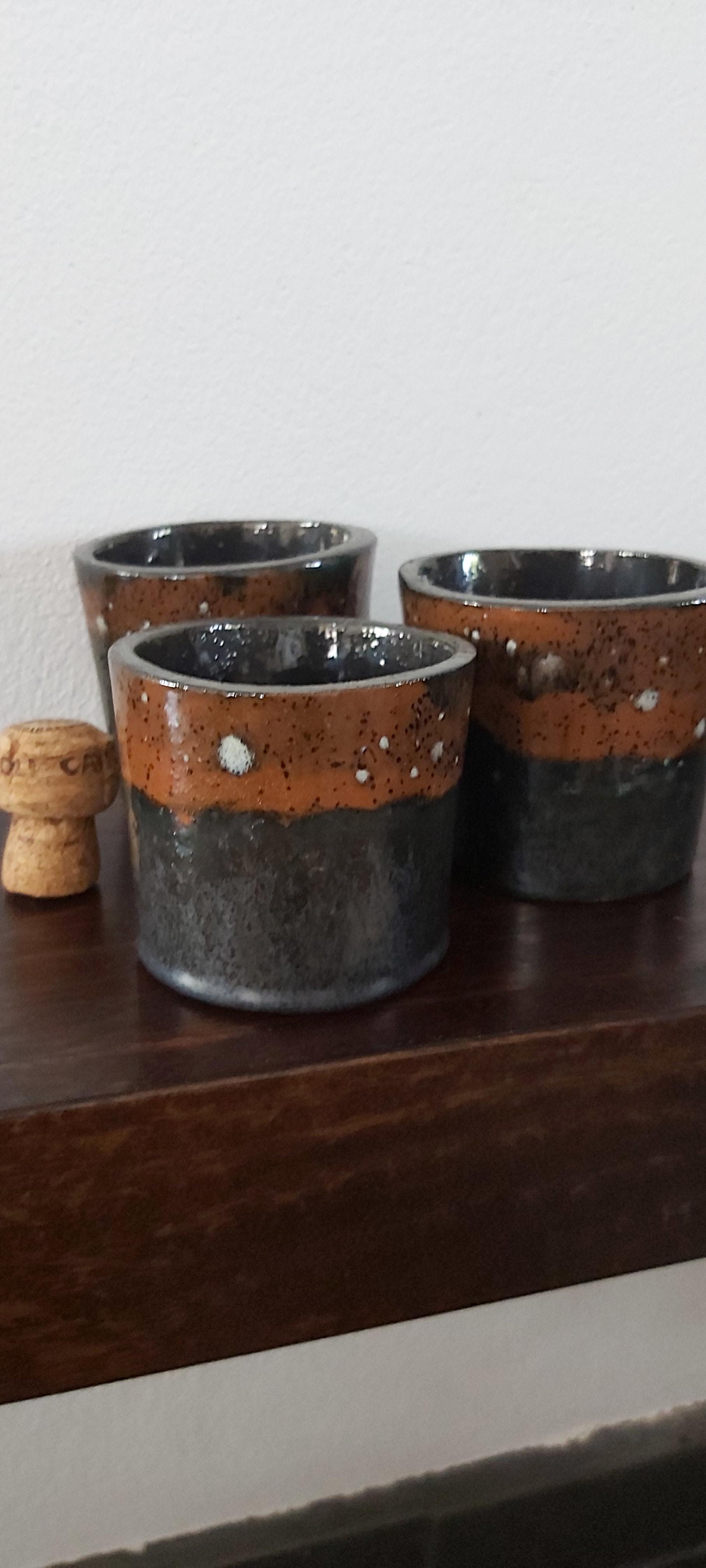 Set of three terracotta pots