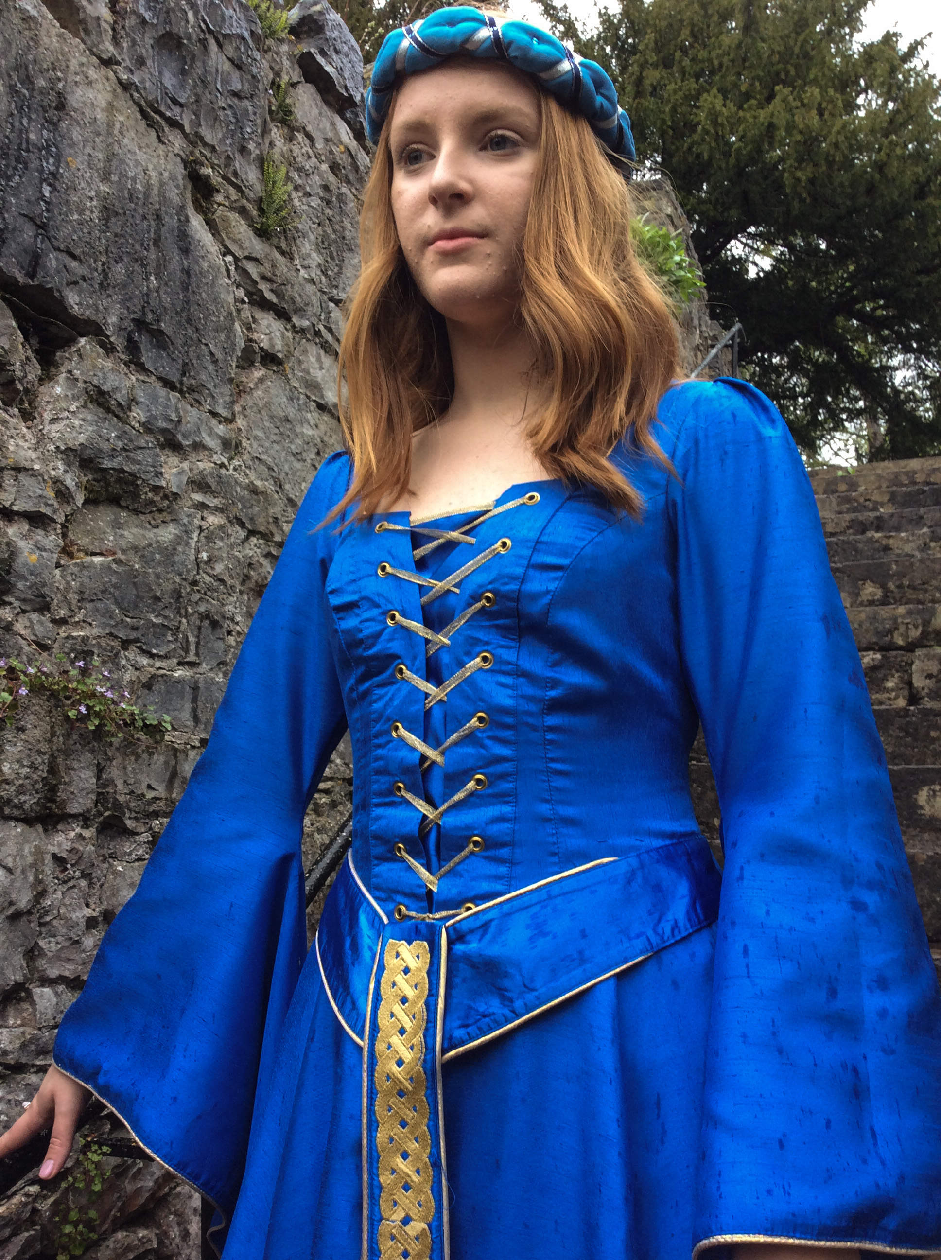 Electric blue medieval dress to hire with bell sleeves and gold lacing