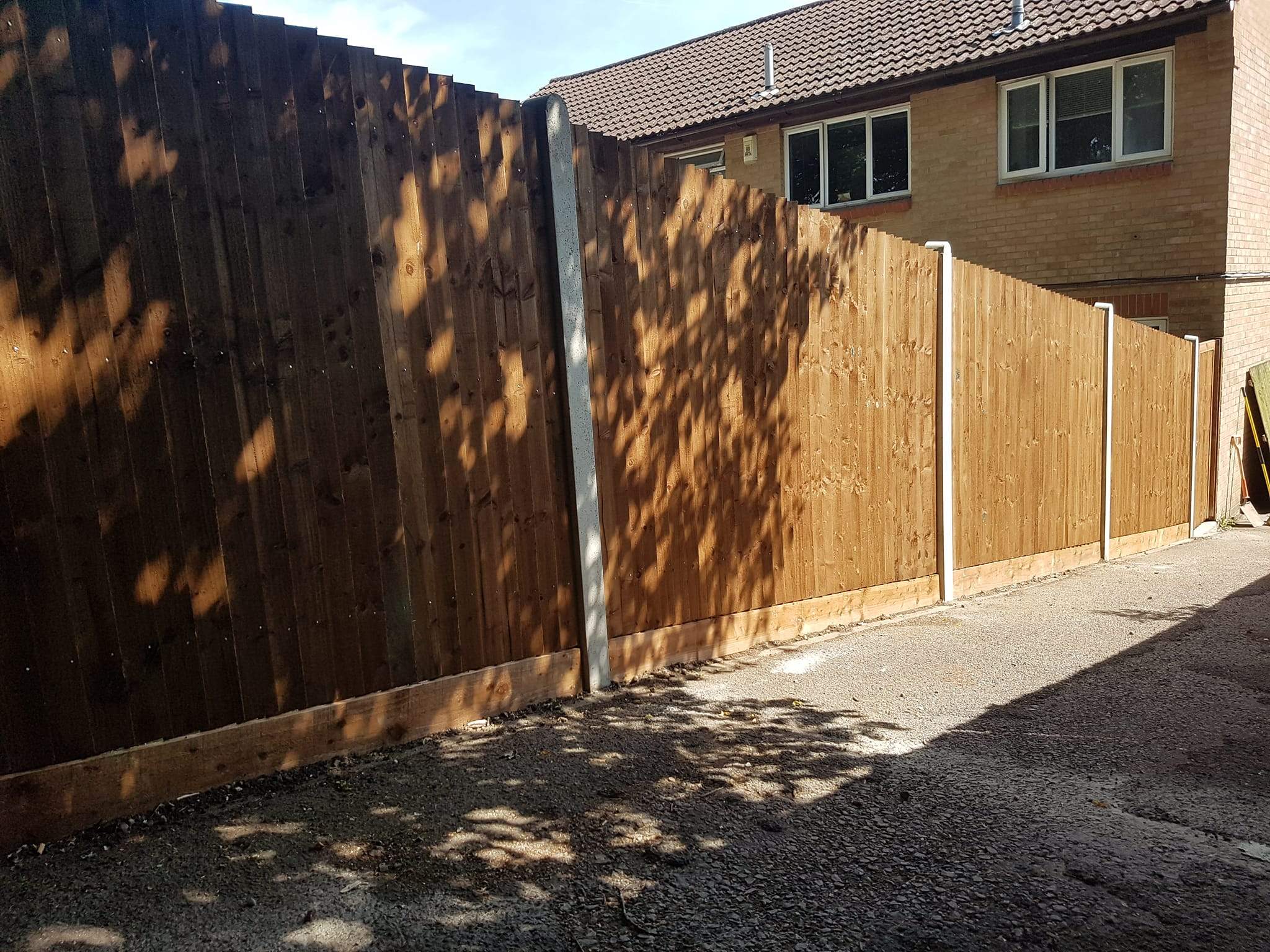With concrete posts and wooden gravel-boards, fencing installed in Waderslade.