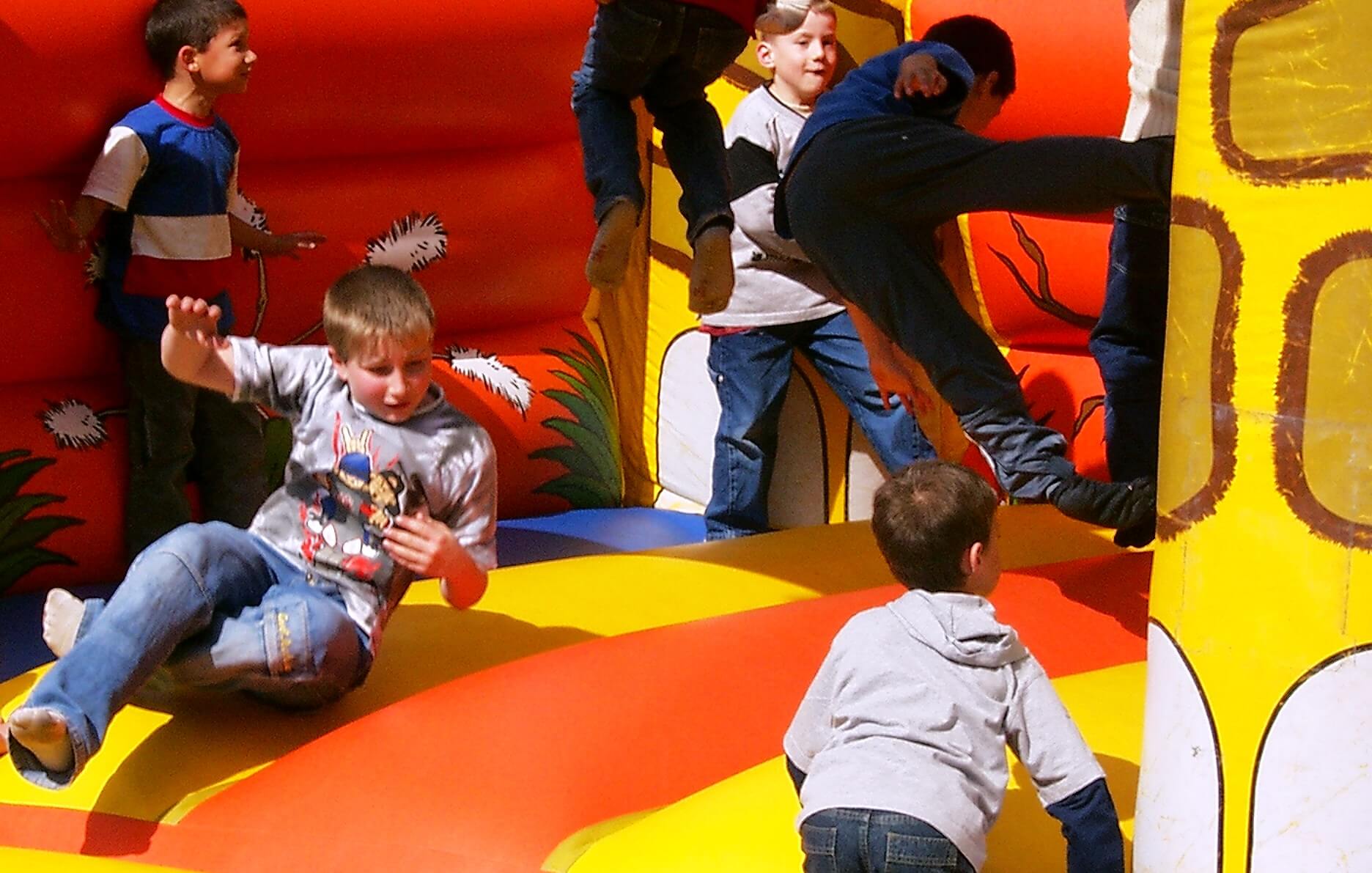 children on  inflatable bouncy castle