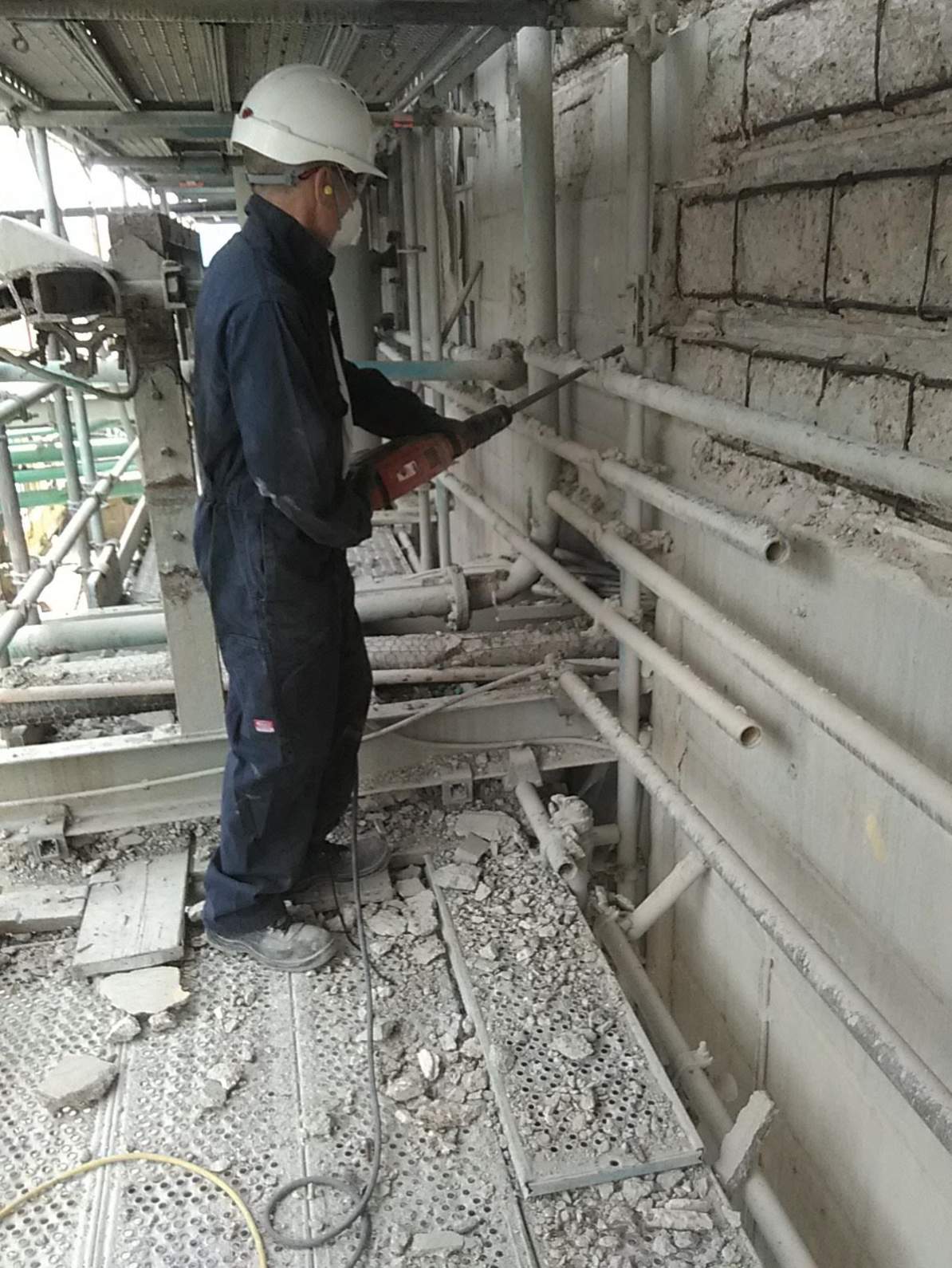 Damaged and defective concrete removed using power tools