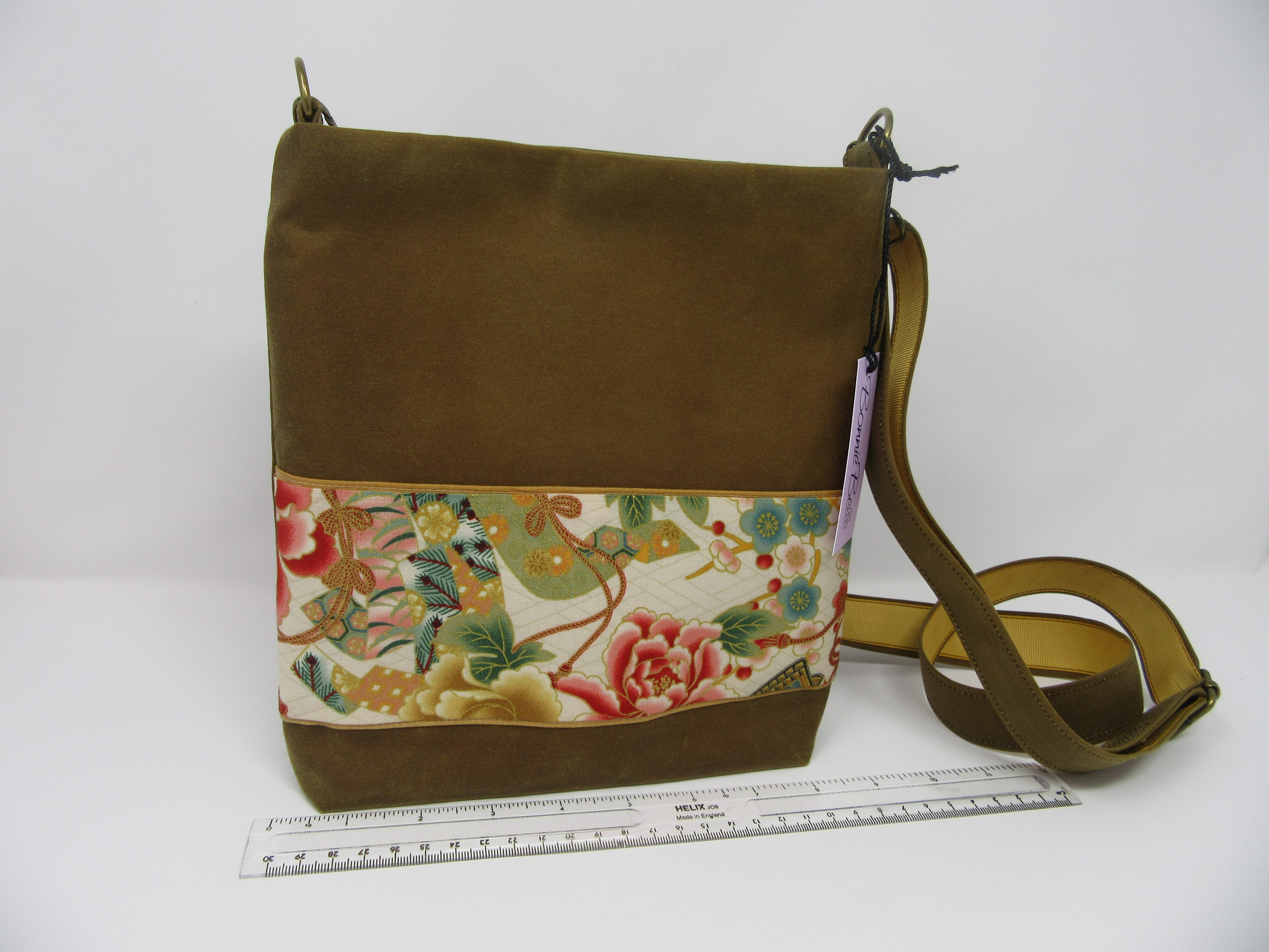 Waxed cotton cross body bag with flower lining