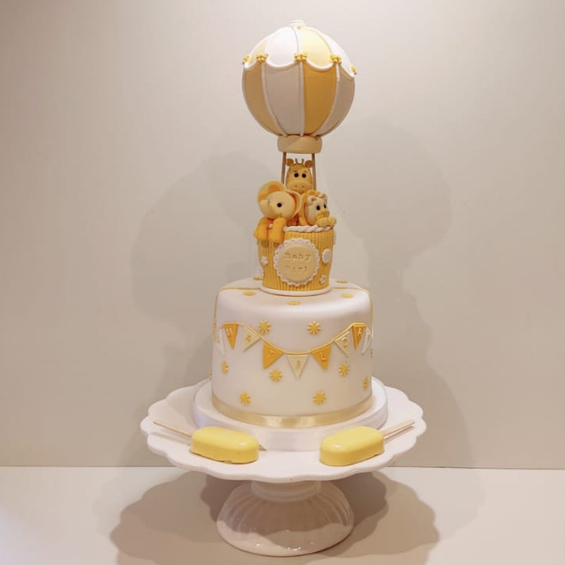 Christening Cake with hot air balloon and animals topper.