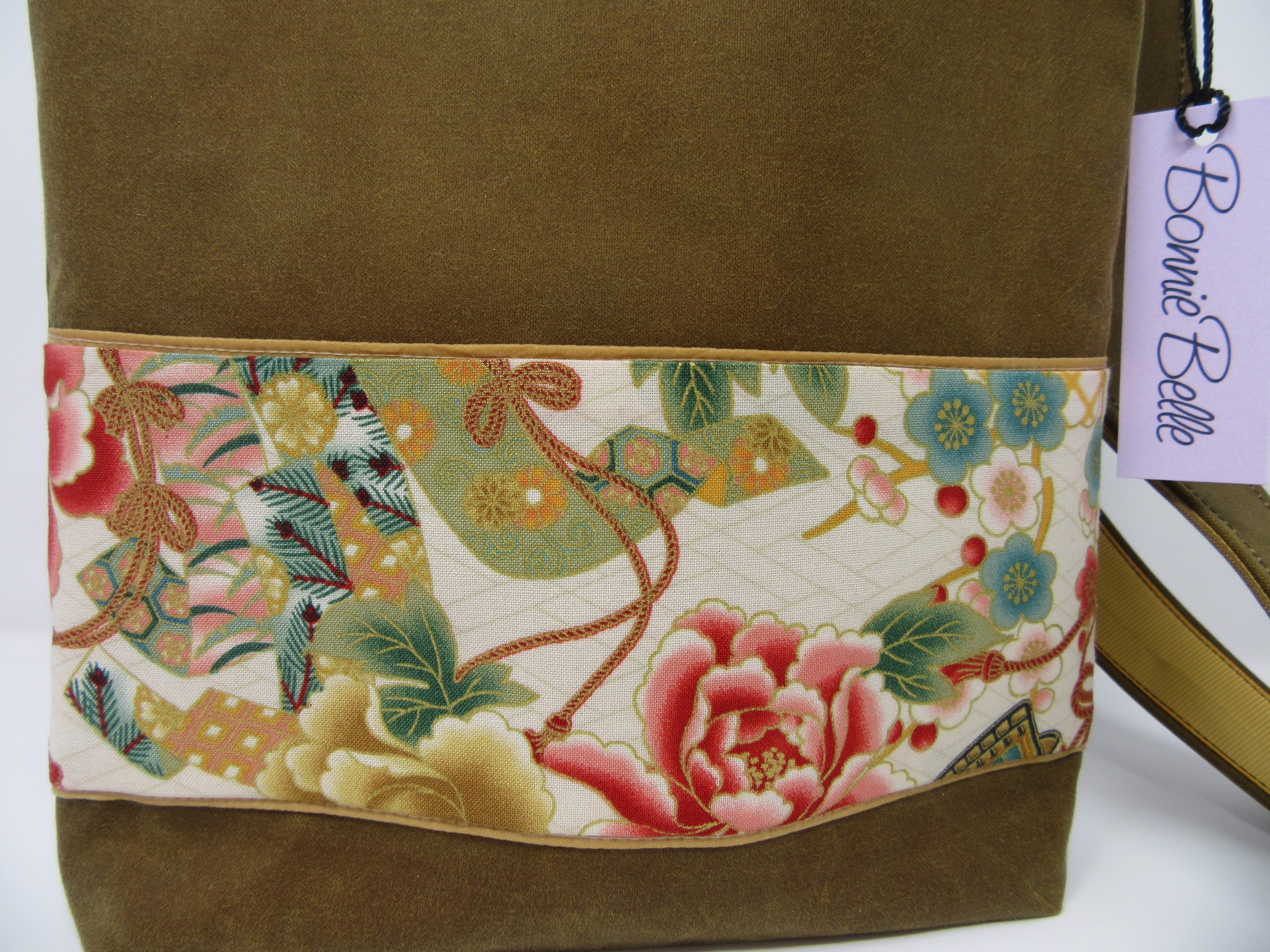 Waxed cotton cross body bag with flower lining