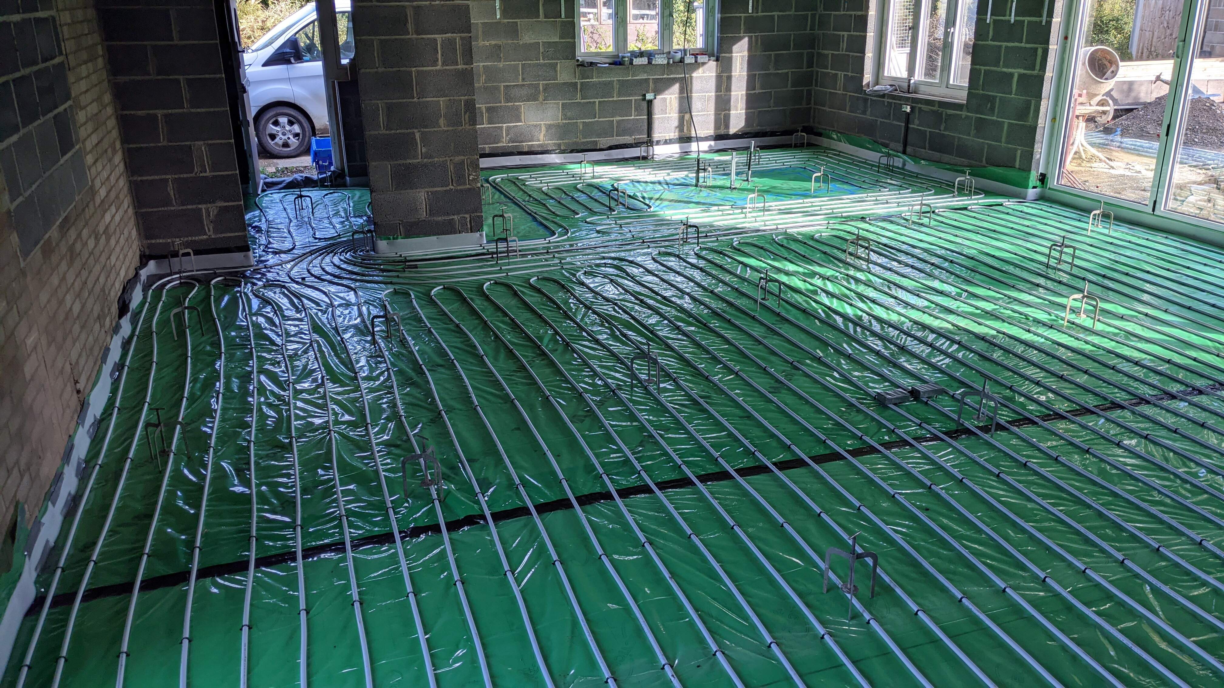 Underfloor heating pipes installed, ready for floor screed