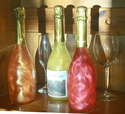 Non alcoholic shimmery sparkling copper, bronze and pink wine