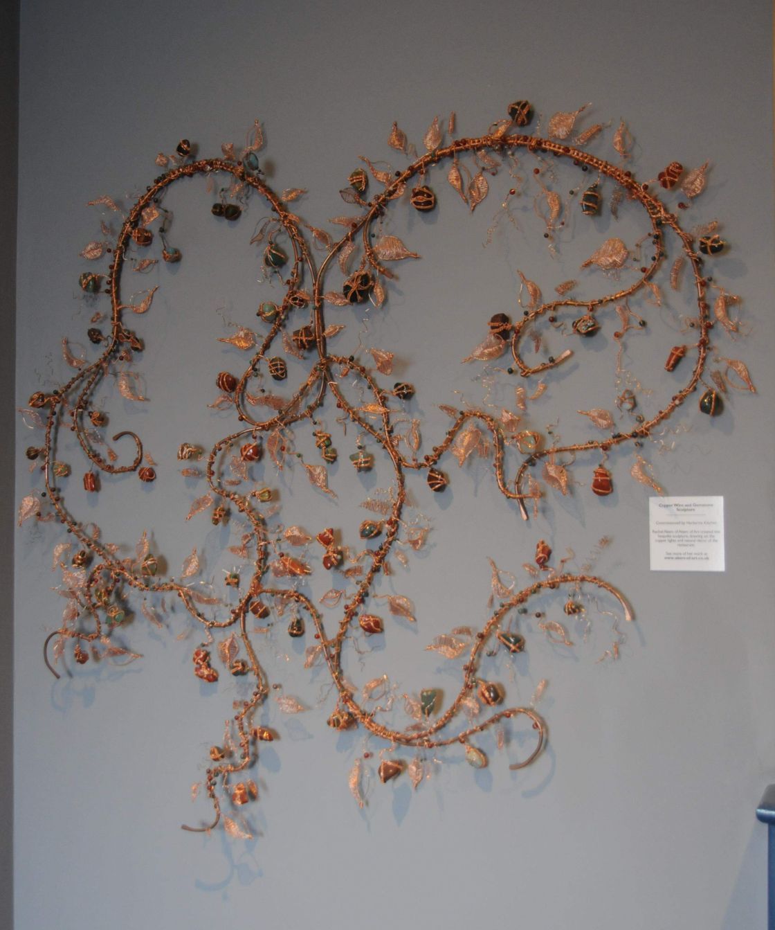 Stunning free form wall art sculpture created using copper wire and approx 65 hand wrapped gemstone