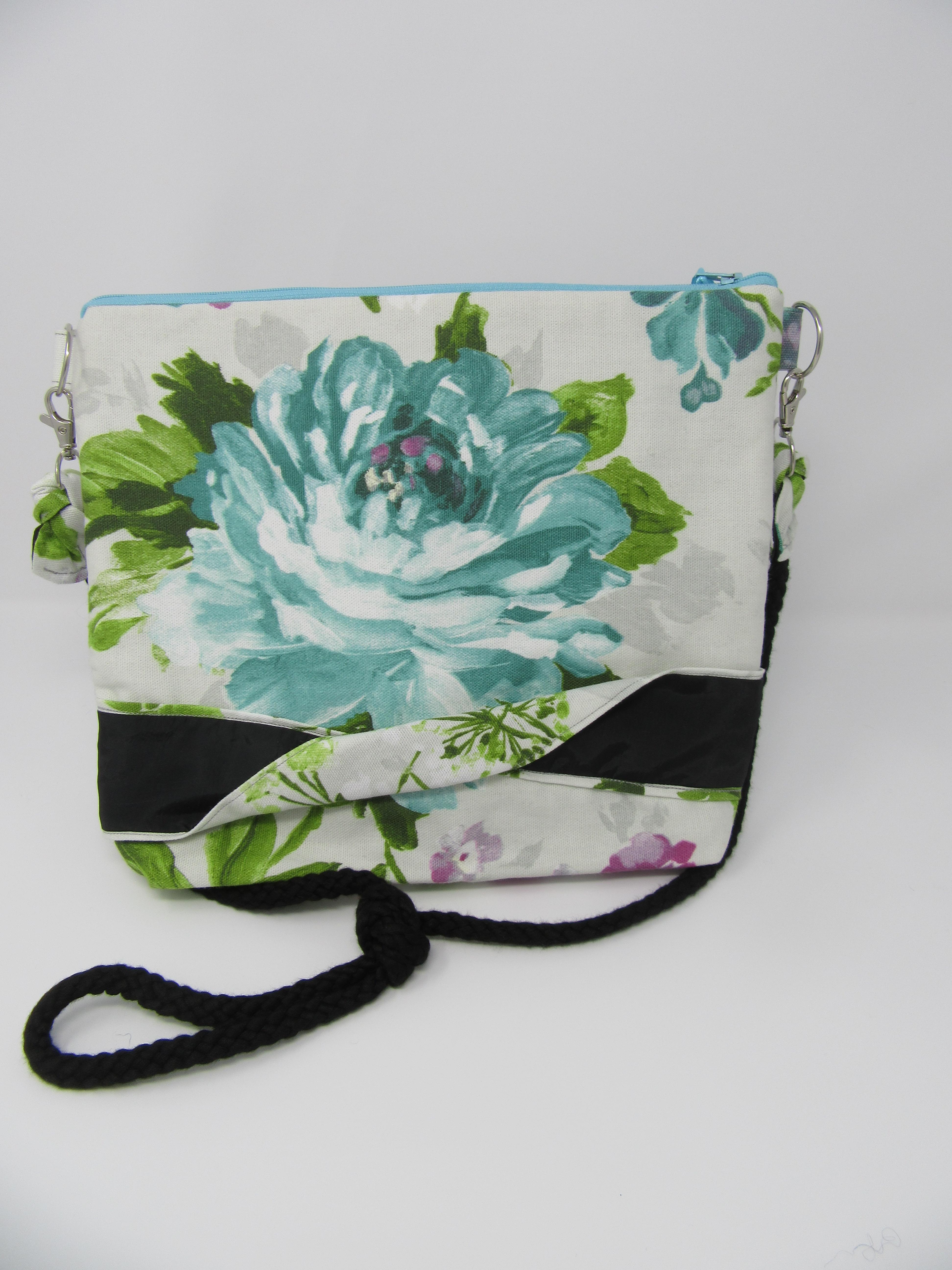 Turquoise rose bag with twisted black panel