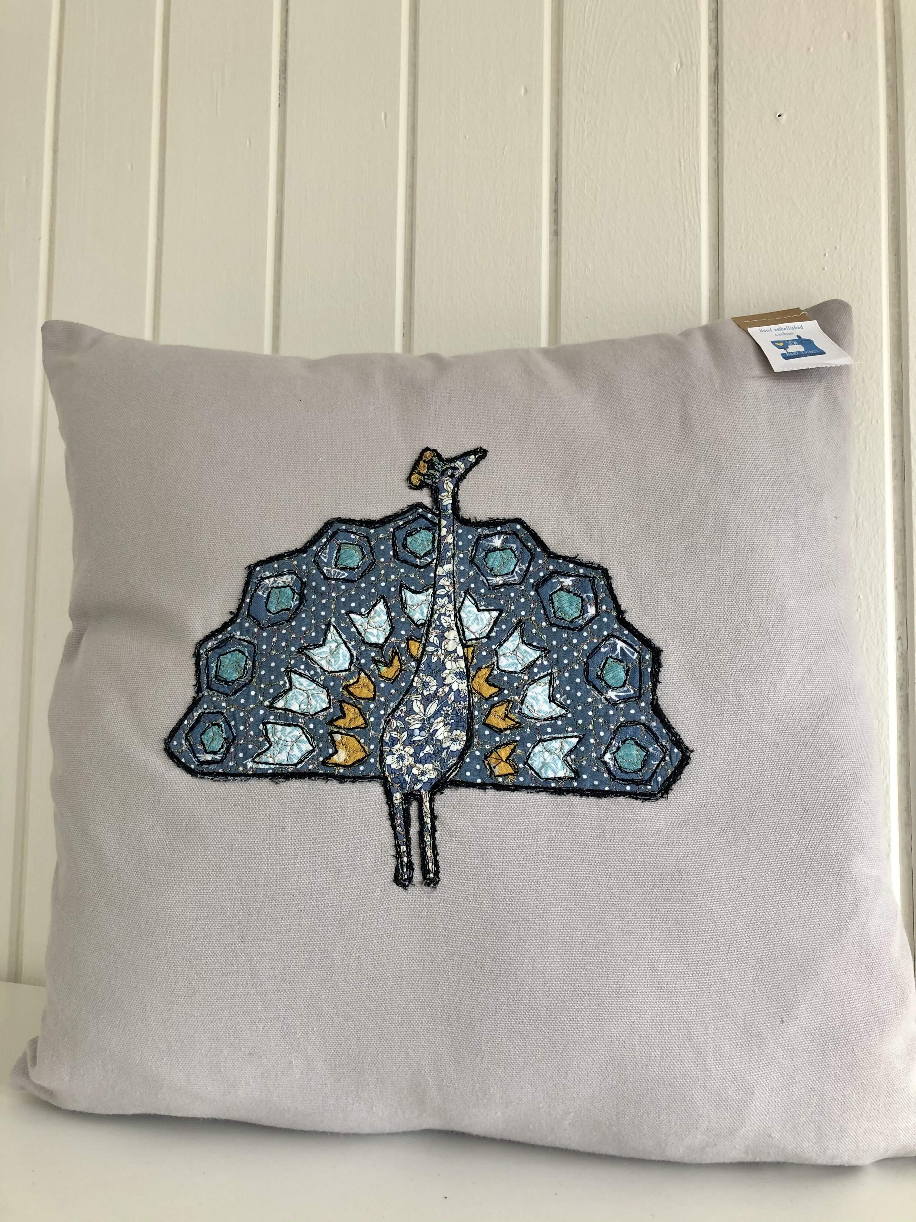 Free motion embroidered cushion. Vibrant colours and sparkly thread.