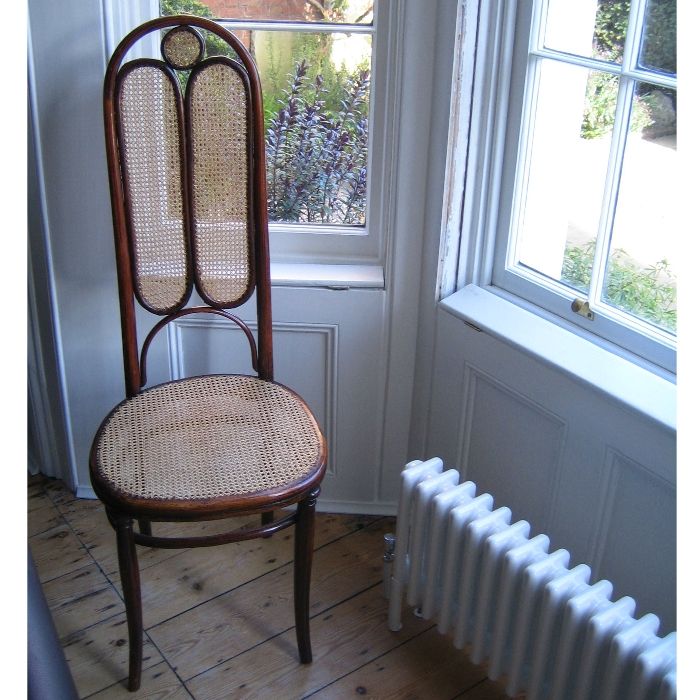 A rare Thonet chair of delicate design. Cleaned re-polished and re-caned.
