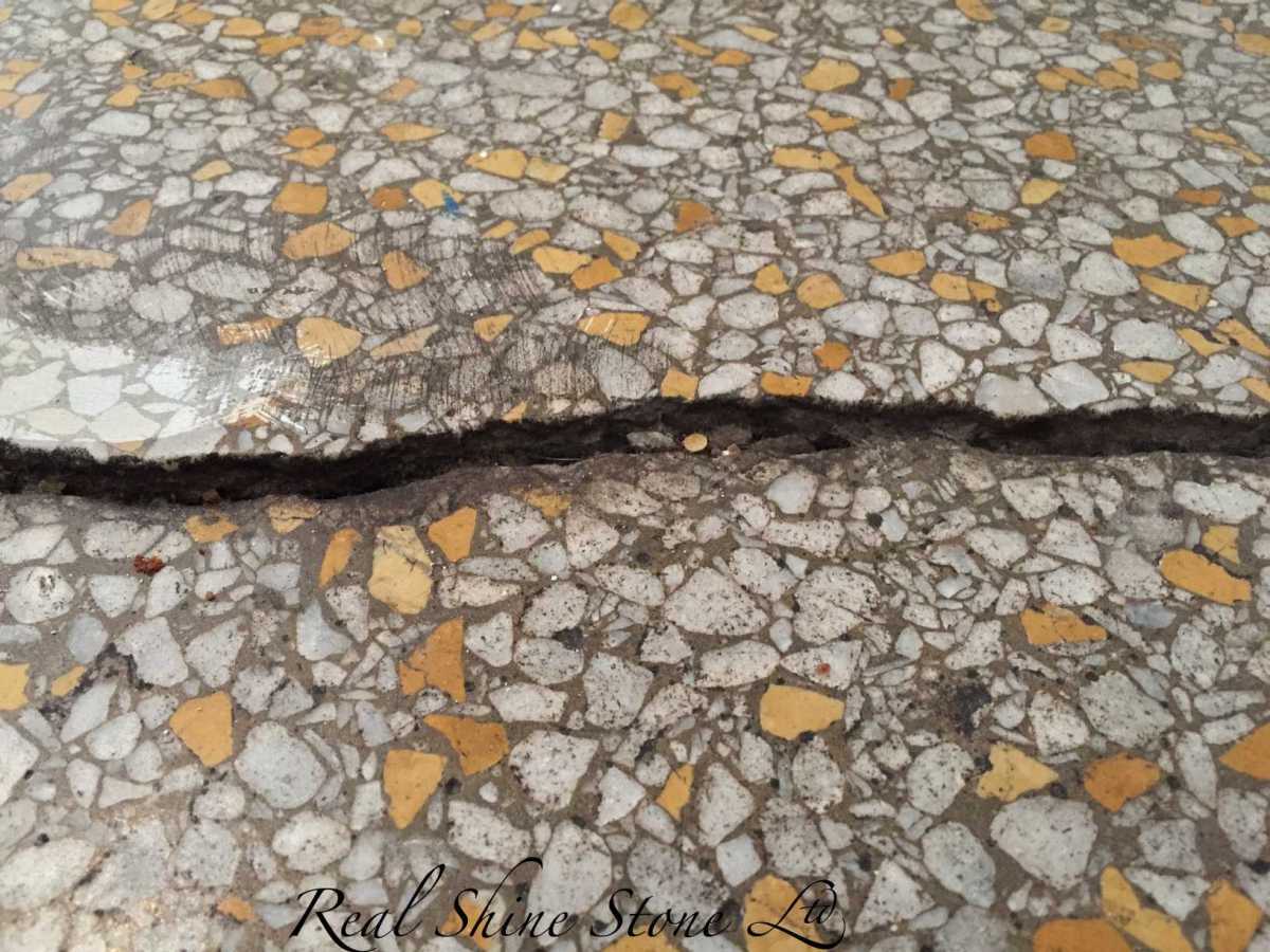 Over time, house and building move. Crack appearing in the terrazzo flooring.