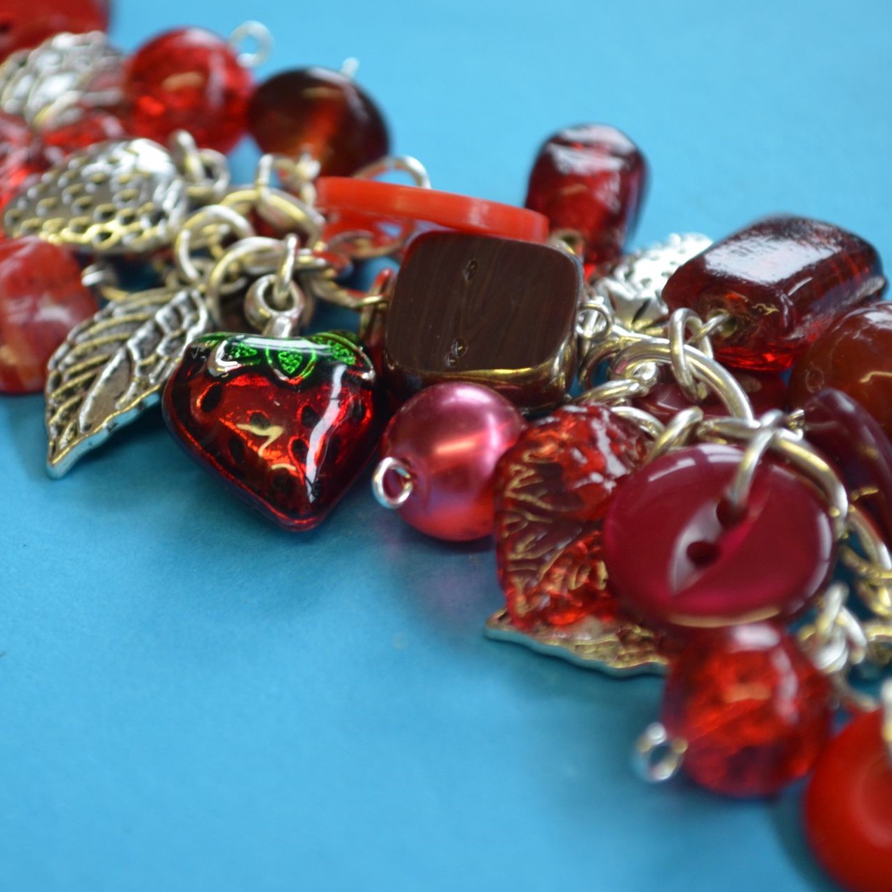 Button, Bead & Strawberry Charm Bracelet