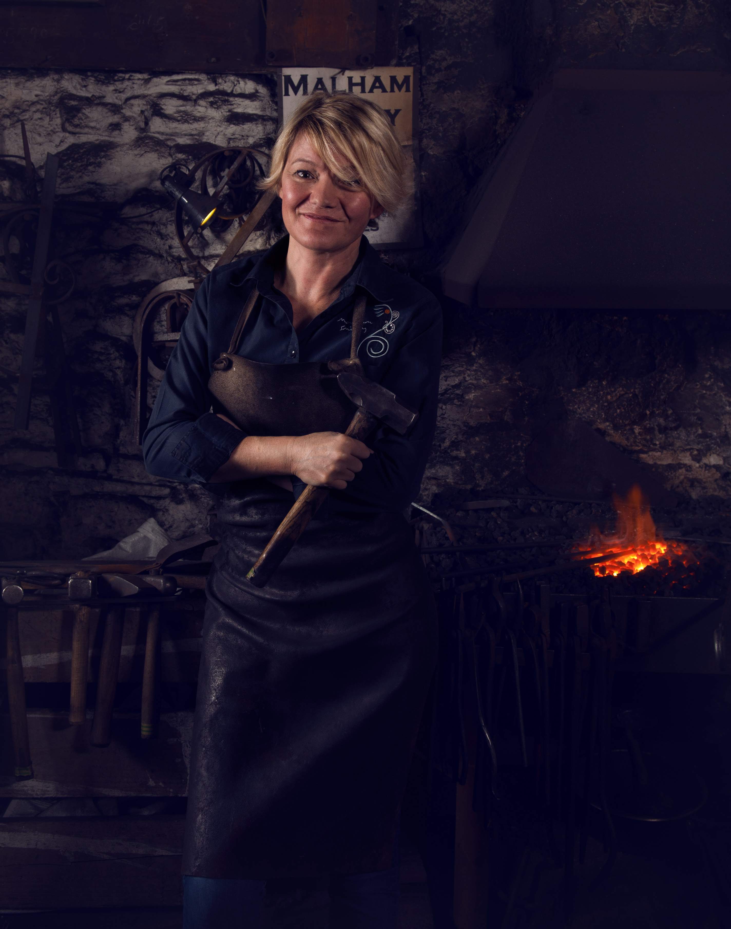 Annabelle Bradley, Blacksmith at the Malham Smithy. Photograph by Clinton Lofthouse
