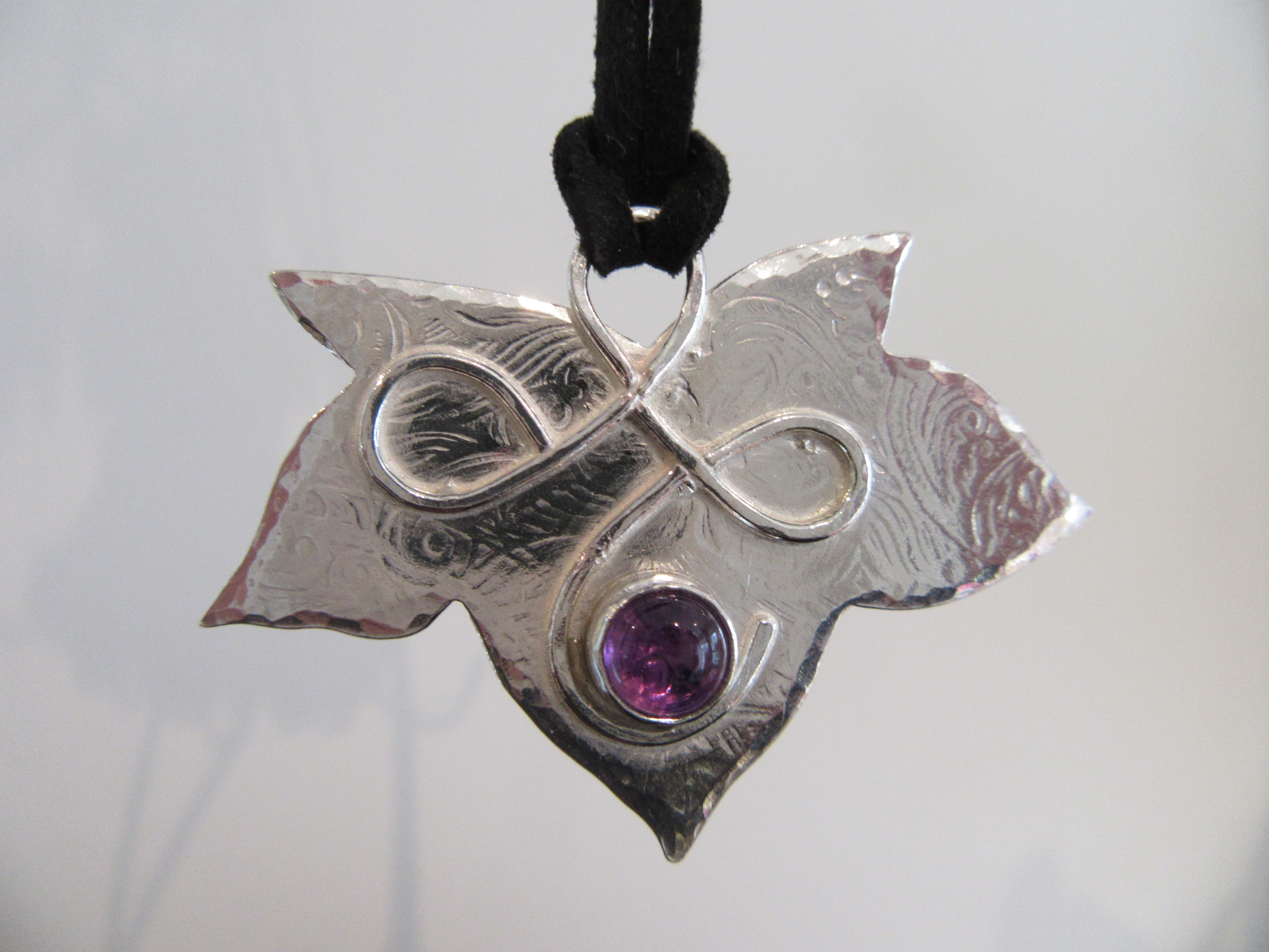 Silver leaf pendant on black suede necklet