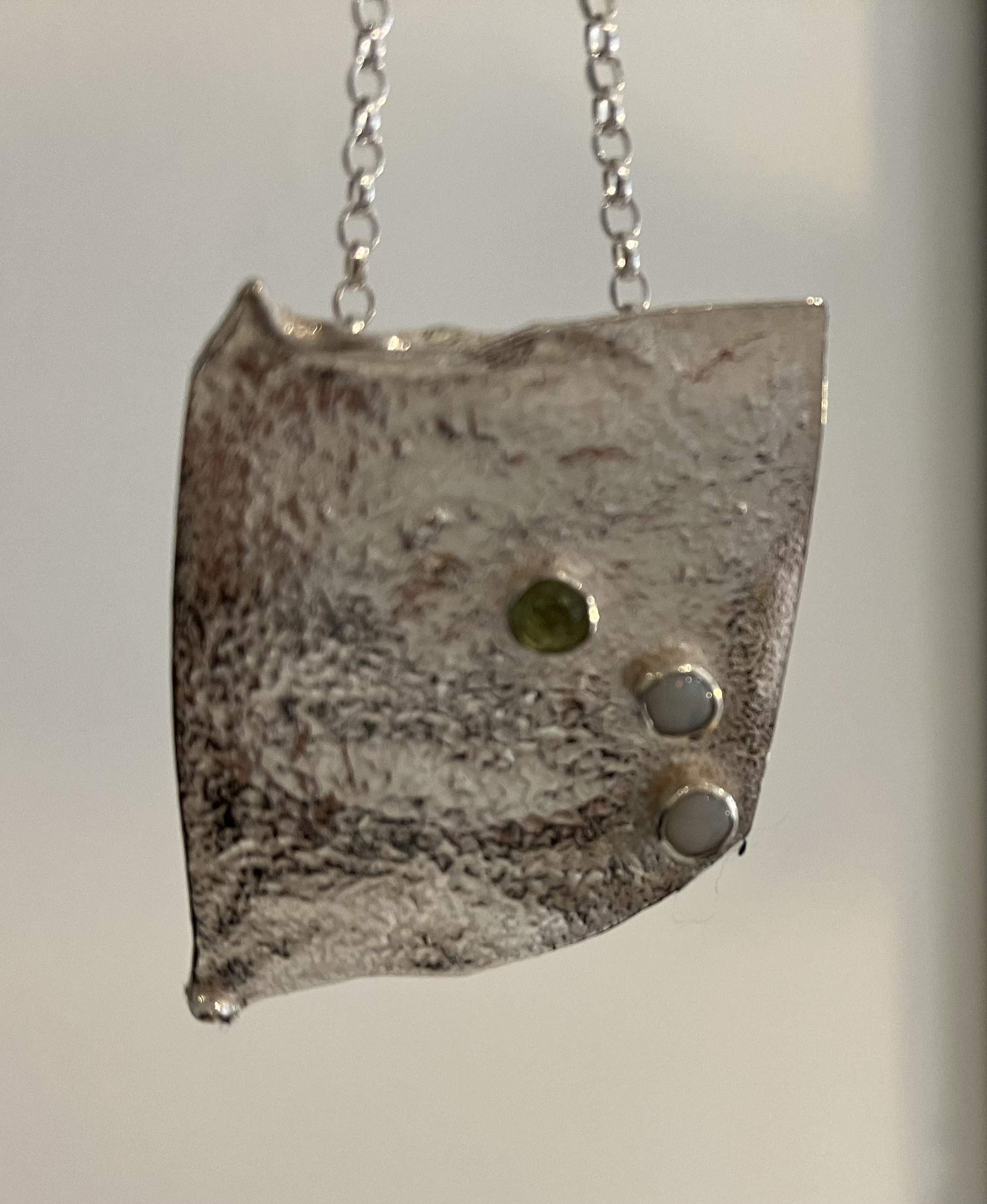Textured silver peridot and opal pendant