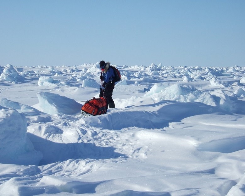 Picture of Claire leading the navigation across ice rubble fields towards Thor Island
