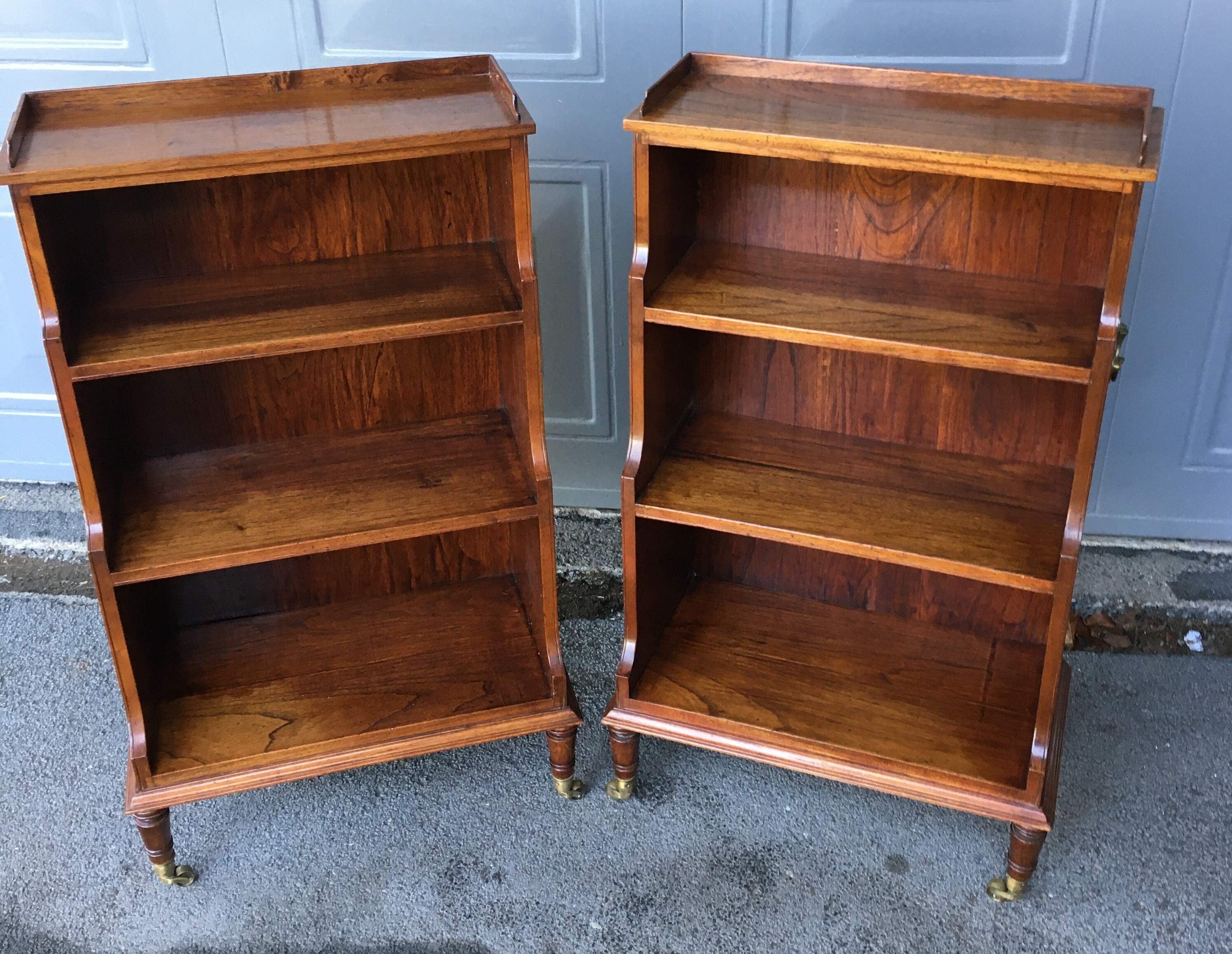 Pair of Teak Waterfall Bookcases on Turned Legs with Castors