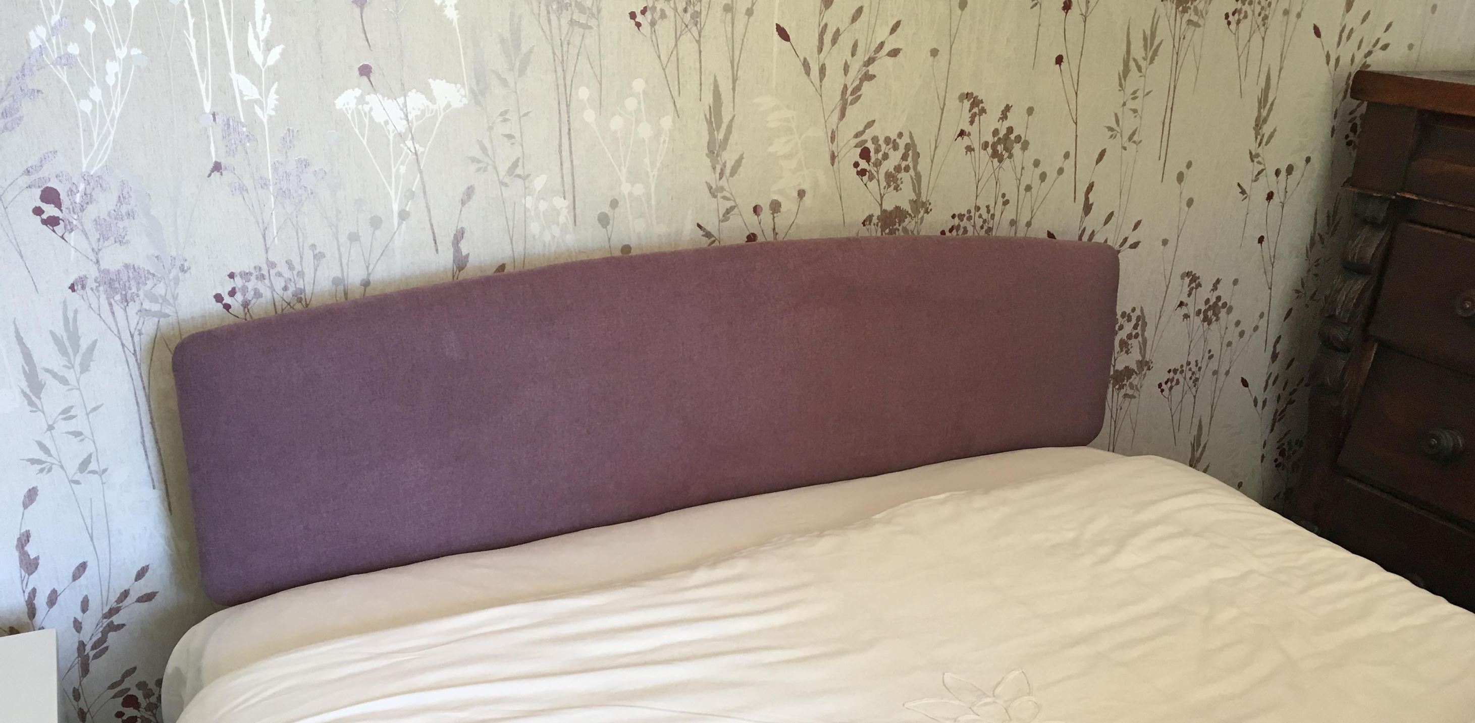 Re-upholstered headboard to match the curtains