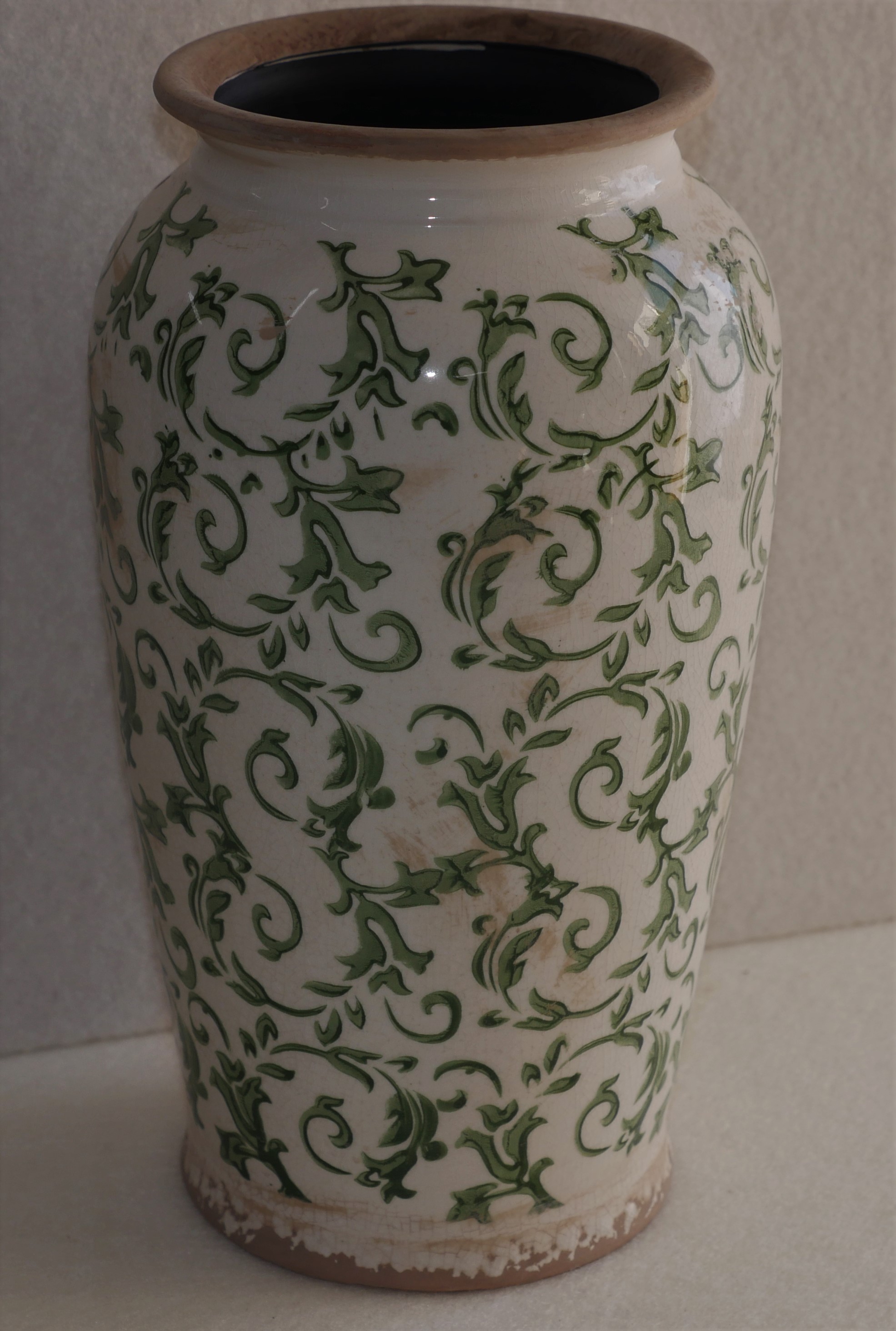 Green and white vintage look pottery vase.