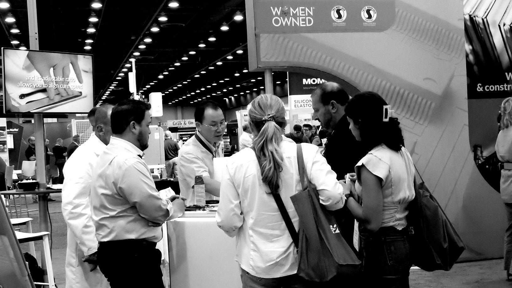 Black and white photo of attendees at the Expo