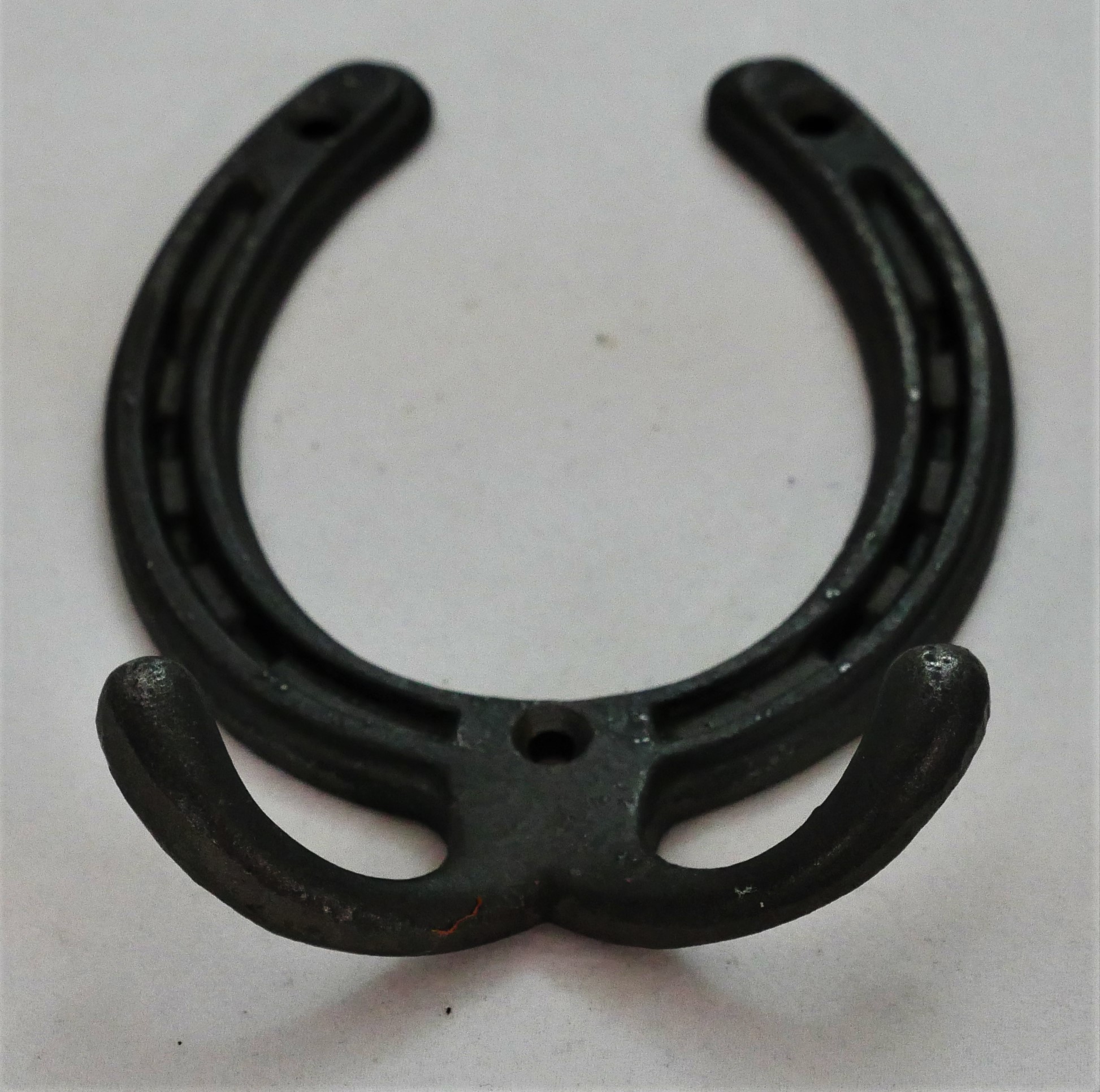 Horse shoe with two hooks.