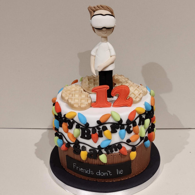 Cake themed on Stranger Things TV series with Virtual Reality character topper.