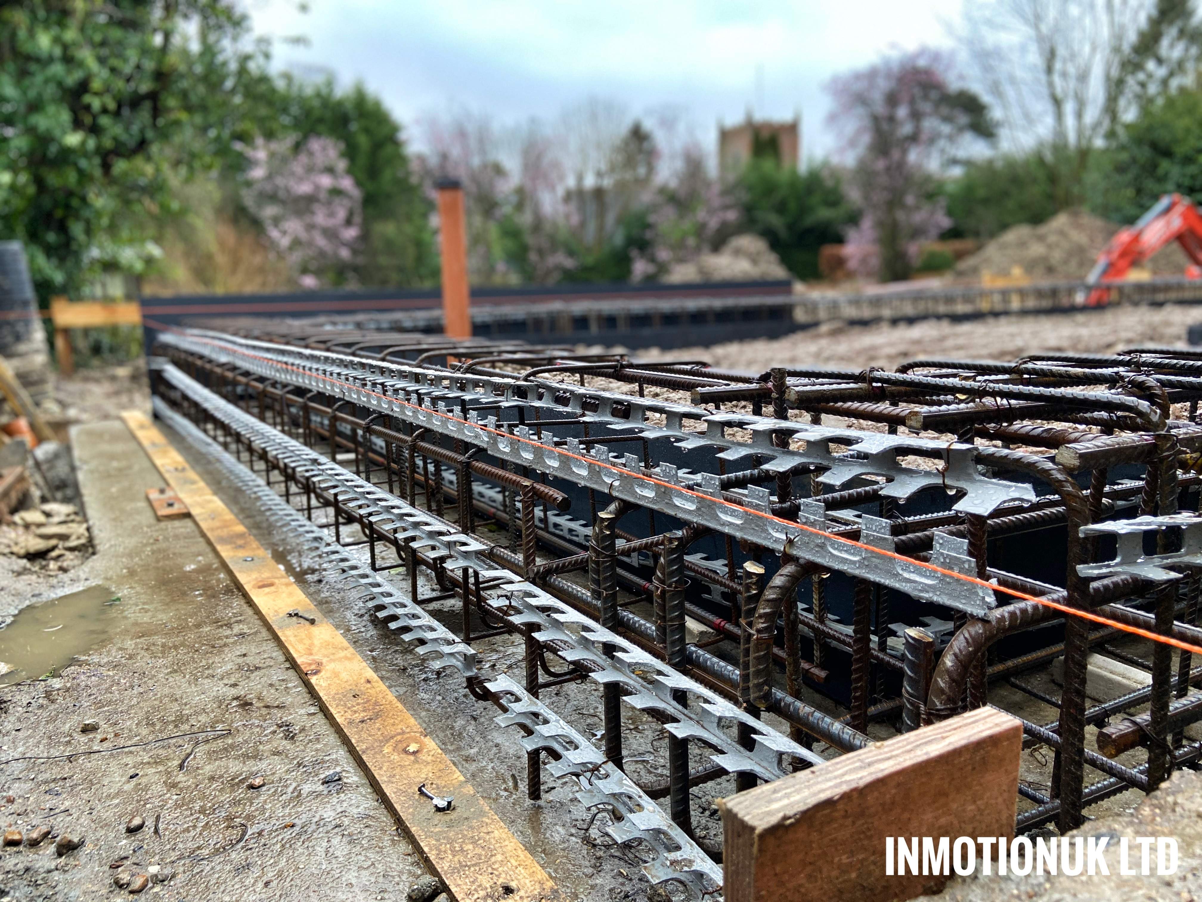Reinforced ground beam/capping beam with detailed step ready for formwork. Groundworks, Henley
